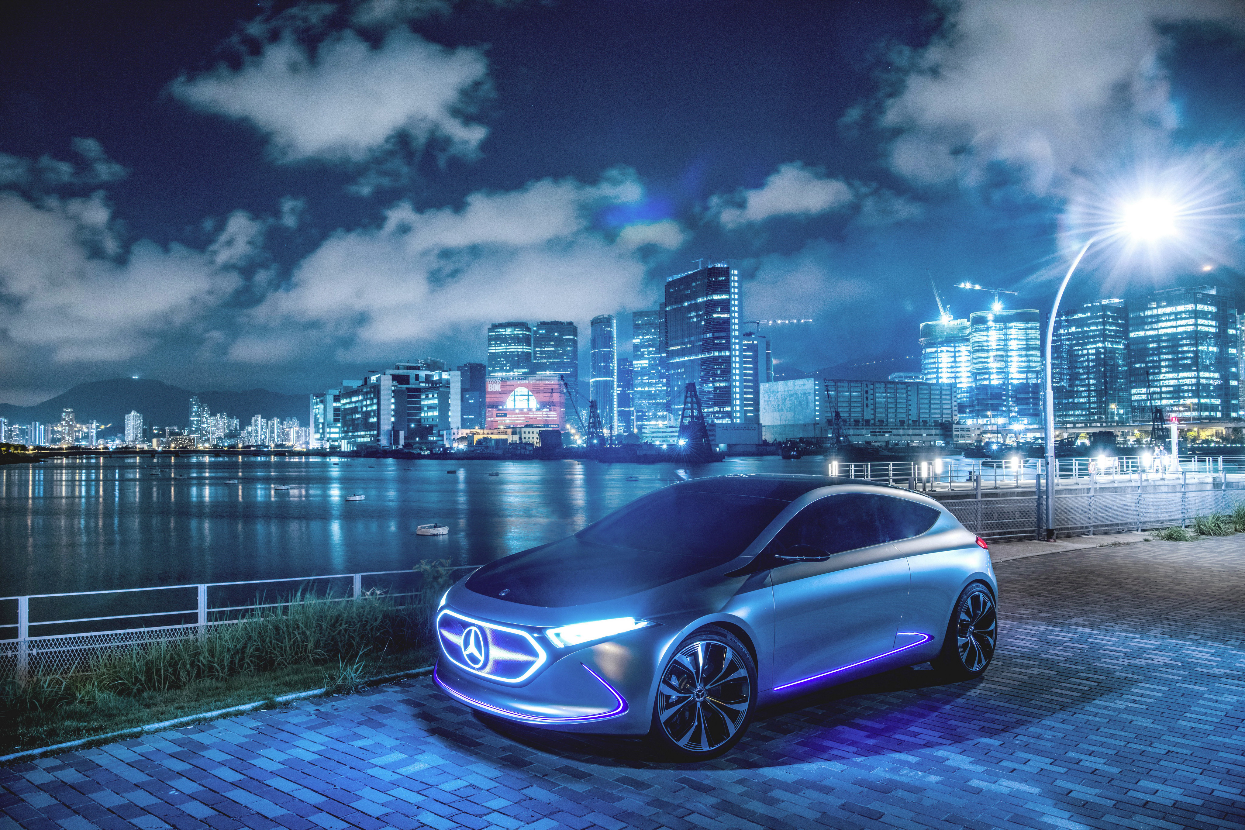 Mercedes-Benz concept car illuminated at night in a city HD Wallpaper