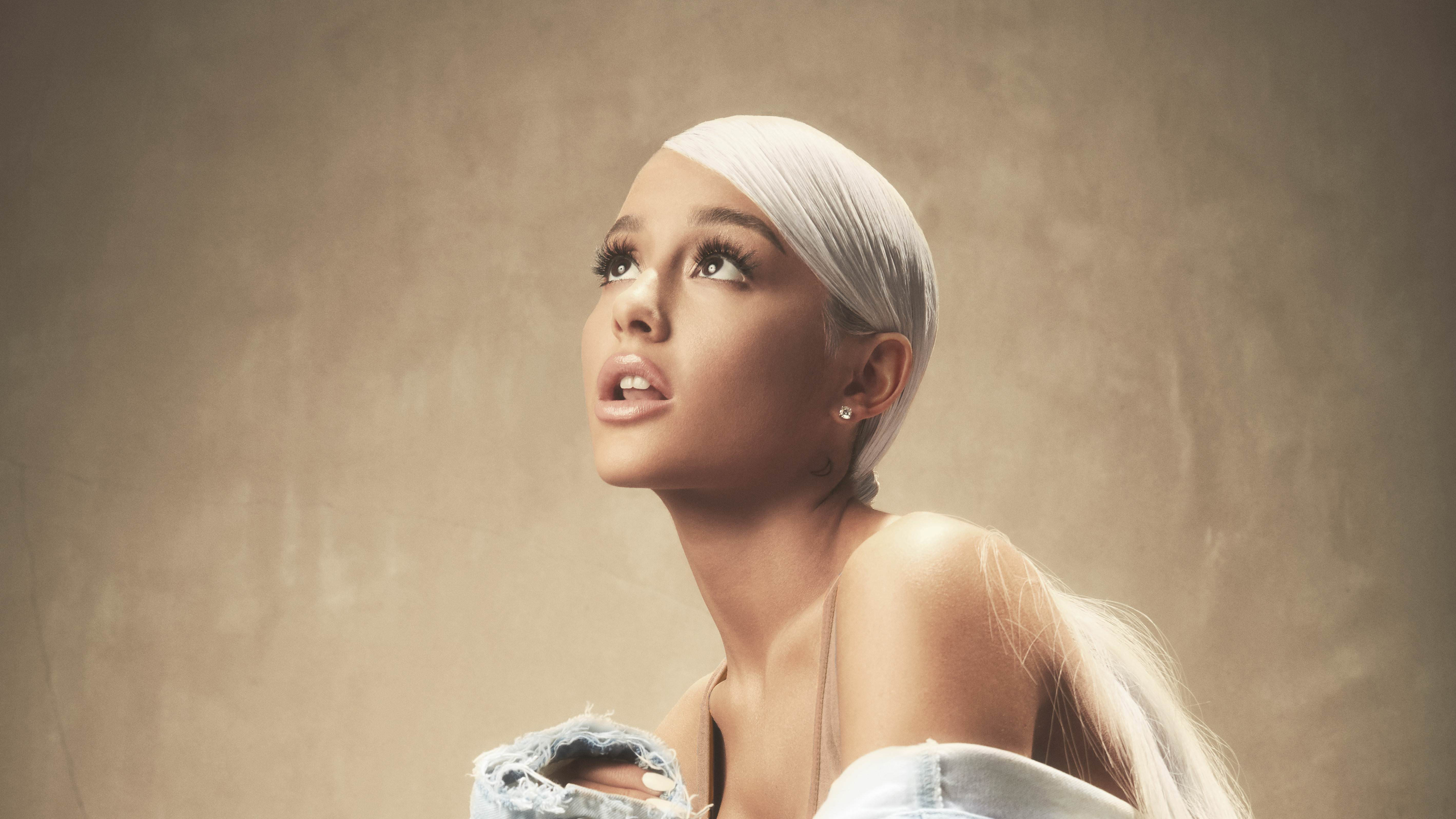 Ariana Grande looking up in a studio portrait HD Wallpaper