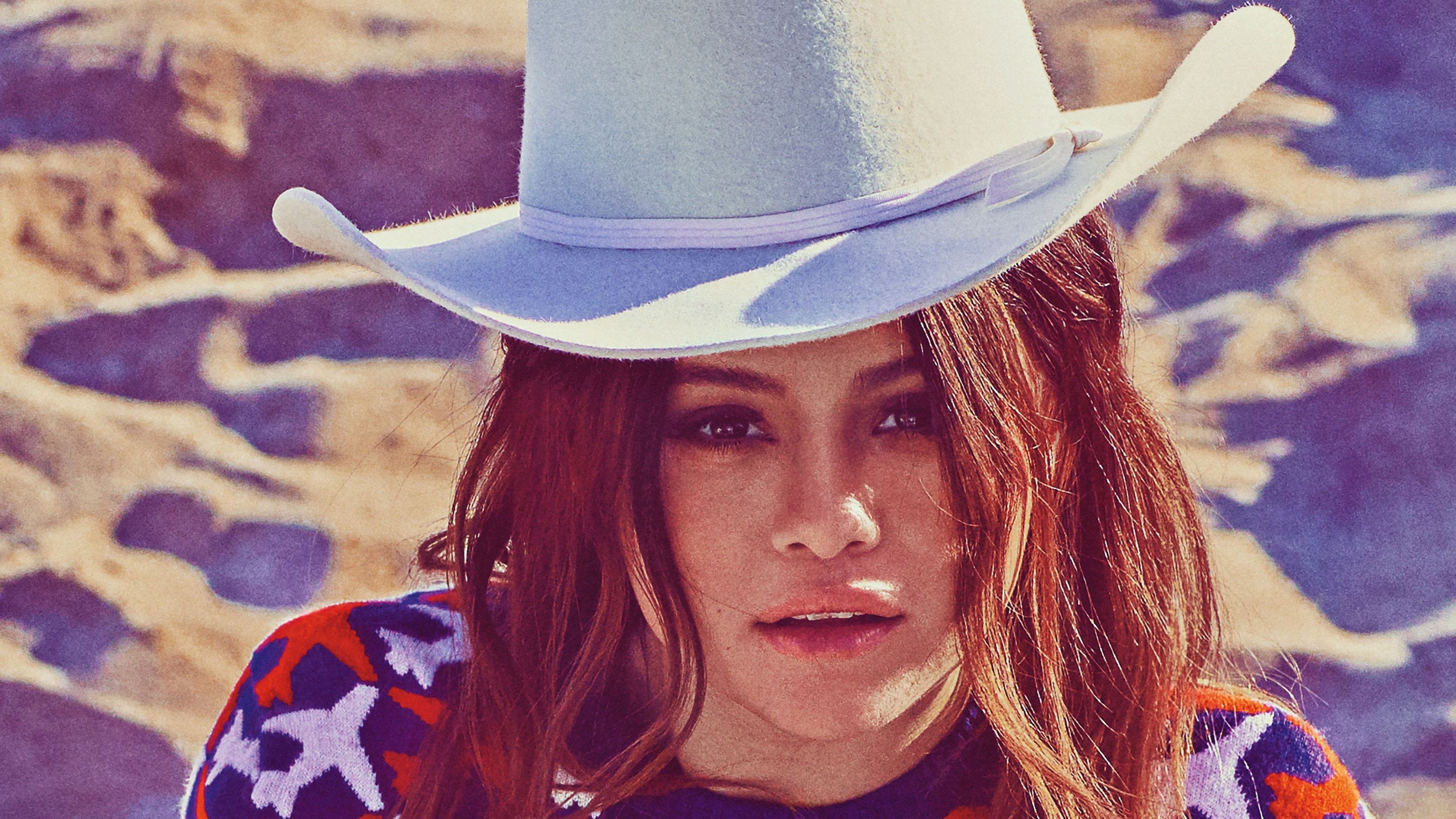 Selena Gomez wearing a cowboy hat and patterned sweater HD Wallpaper