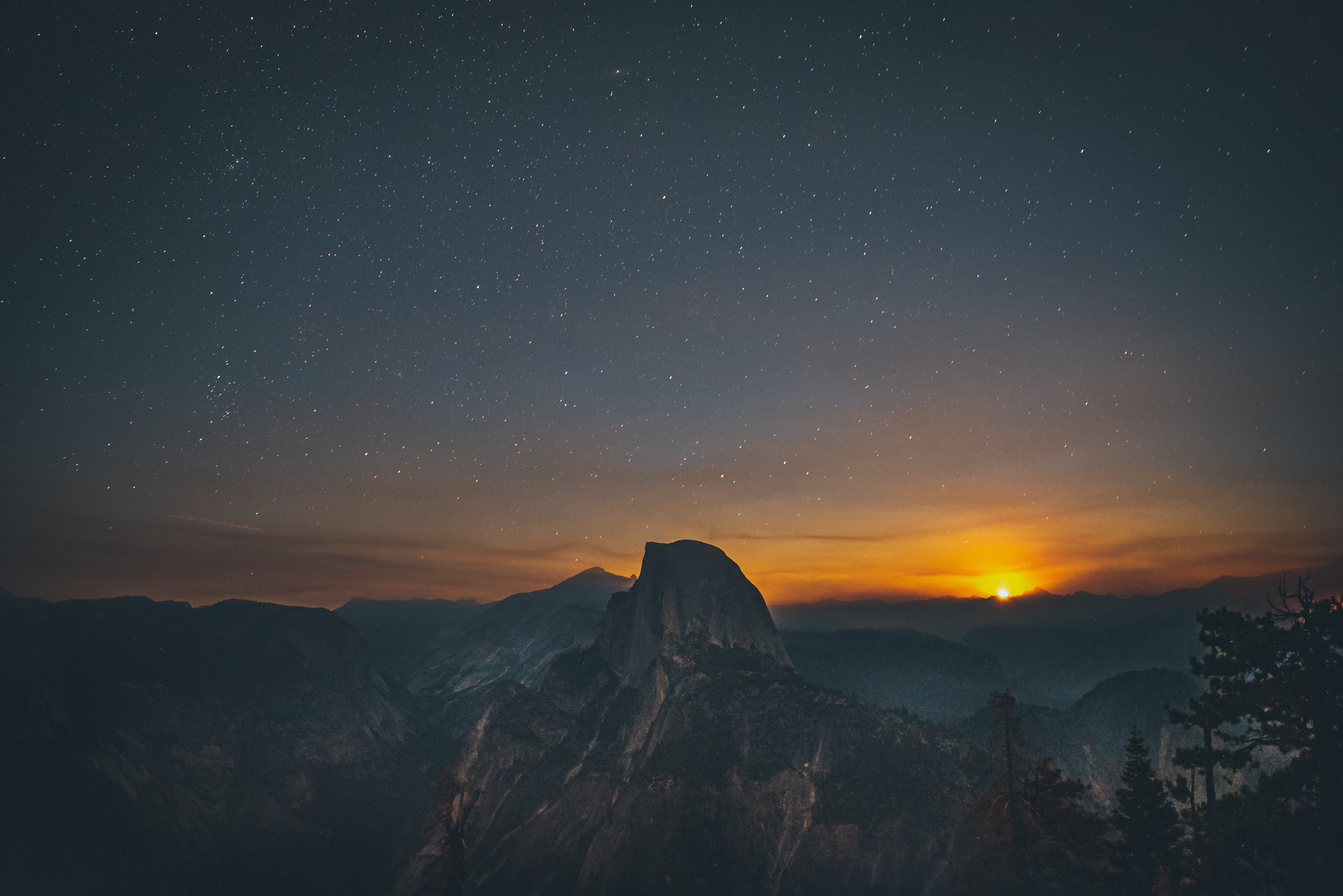 Yosemite National Park at night with stars and sunset HD Wallpaper