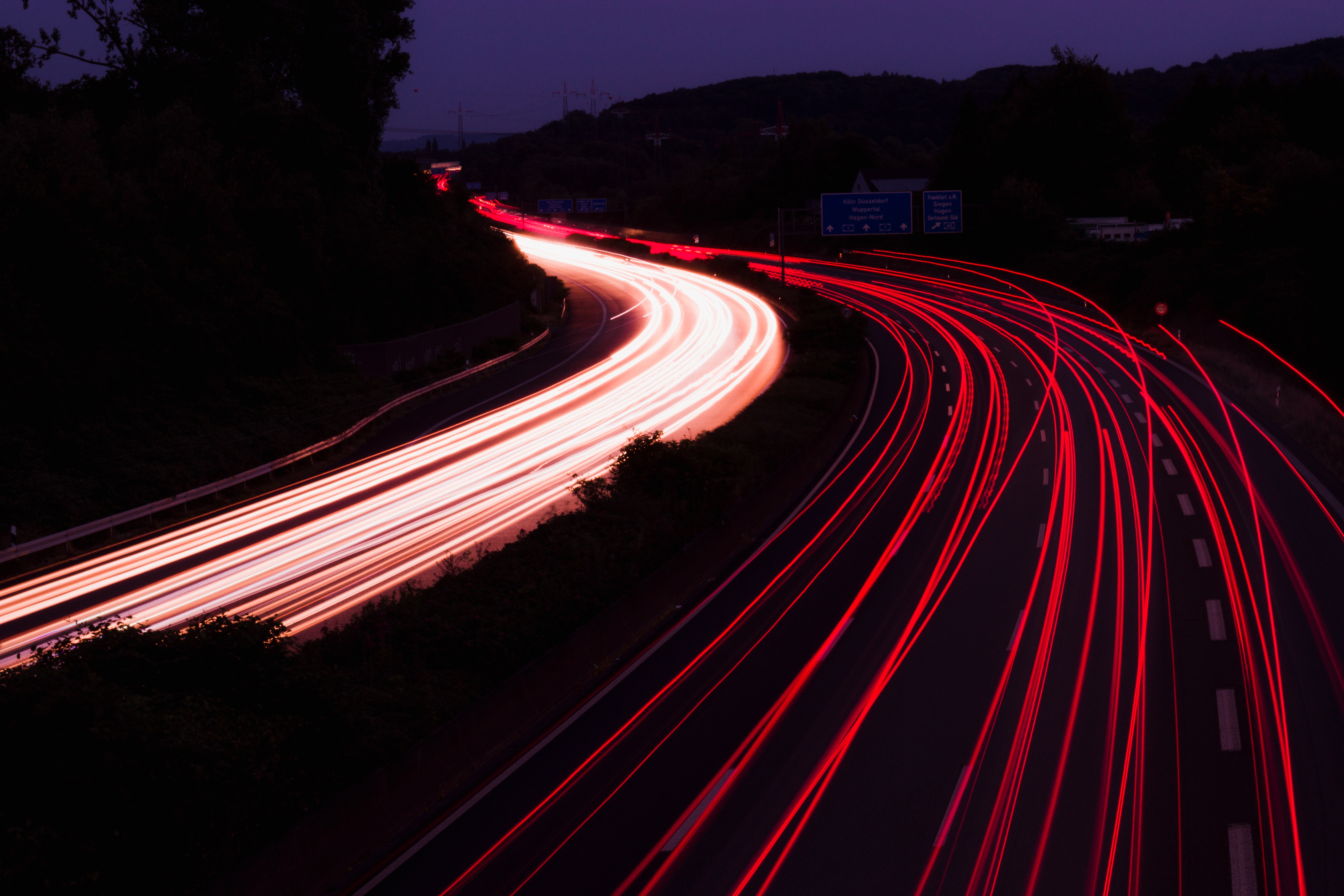 Long exposure highway at night with light trails HD Wallpaper