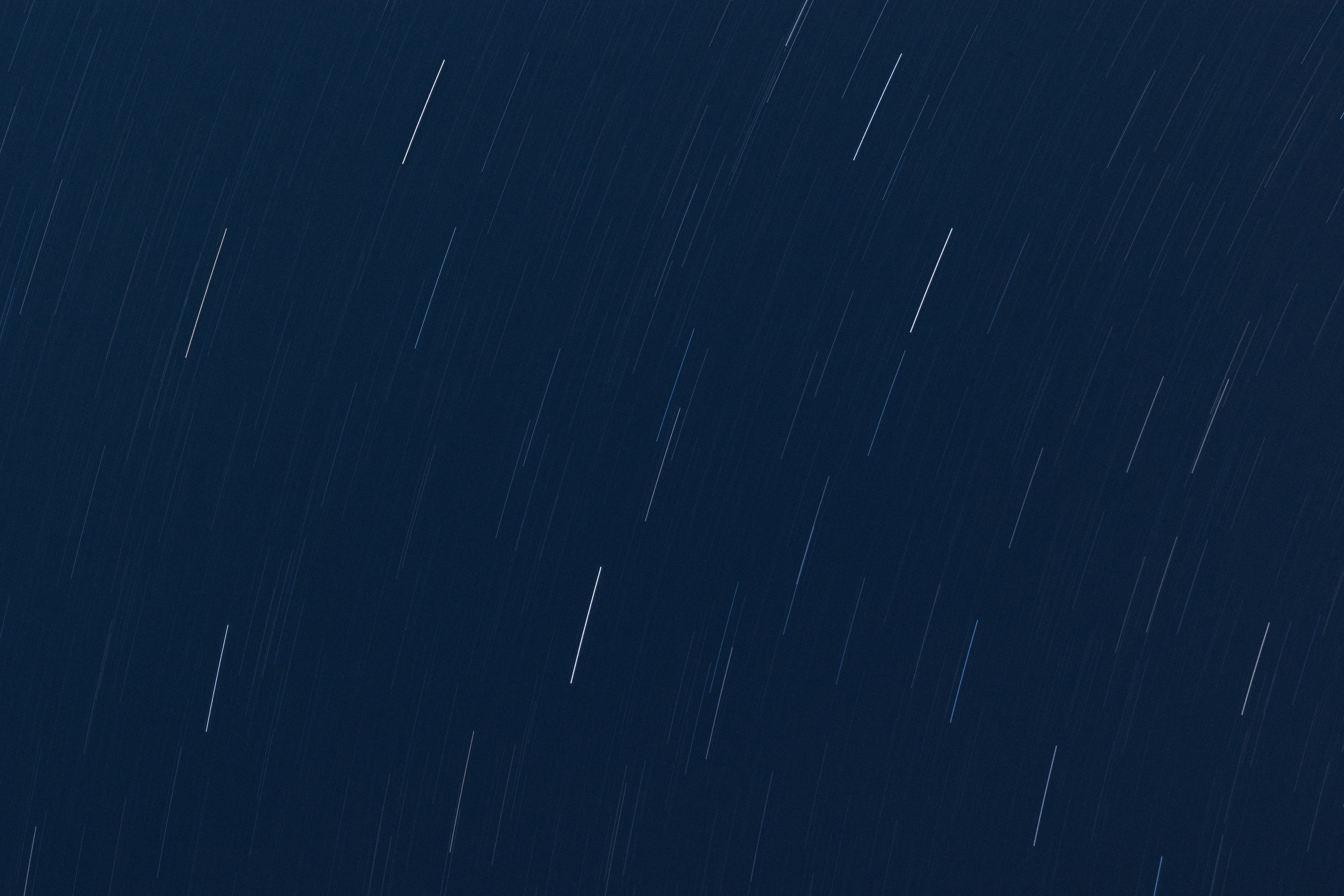Star trails in the night sky HD Wallpaper