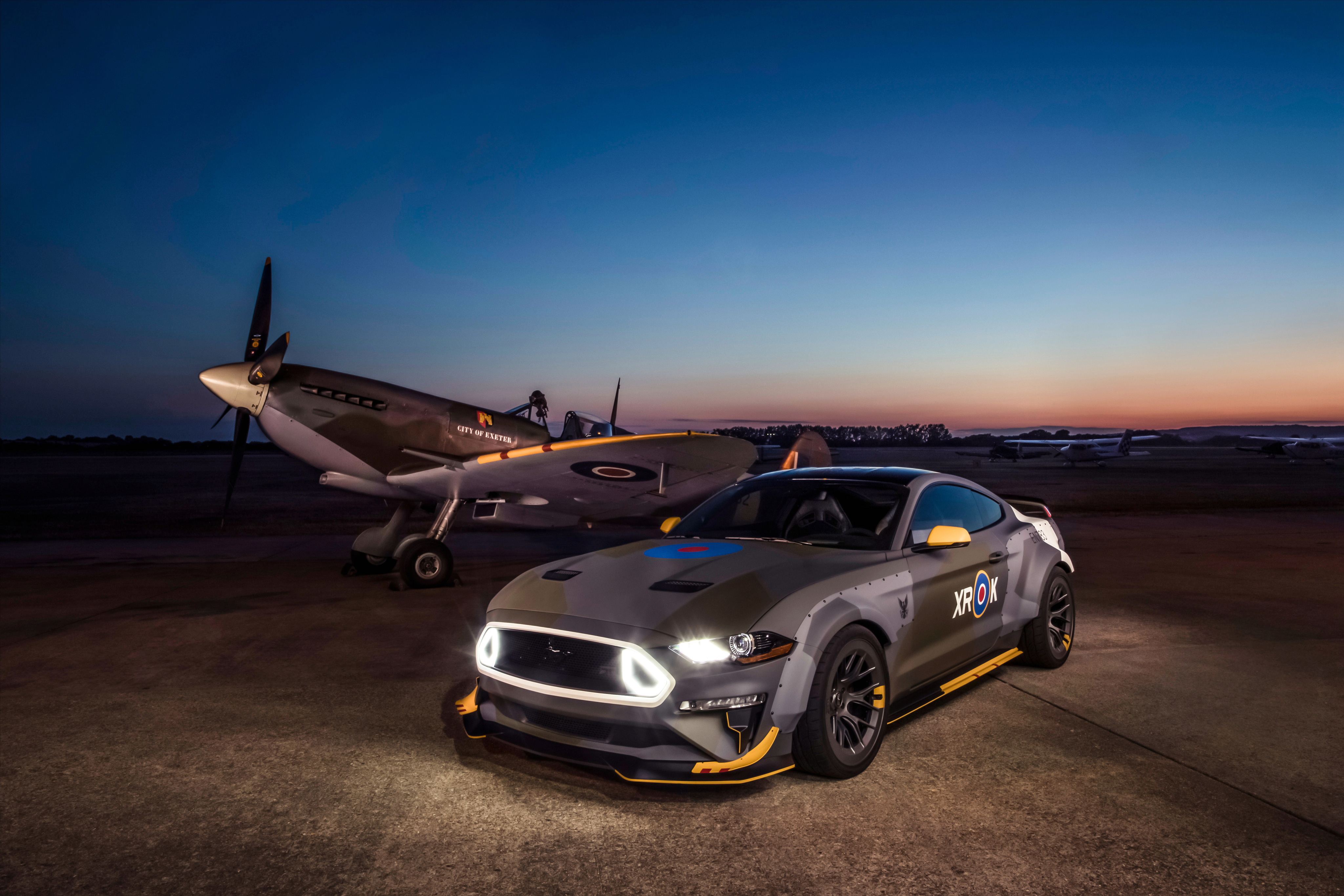 Ford Mustang and Spitfire airplane at dusk HD Wallpaper