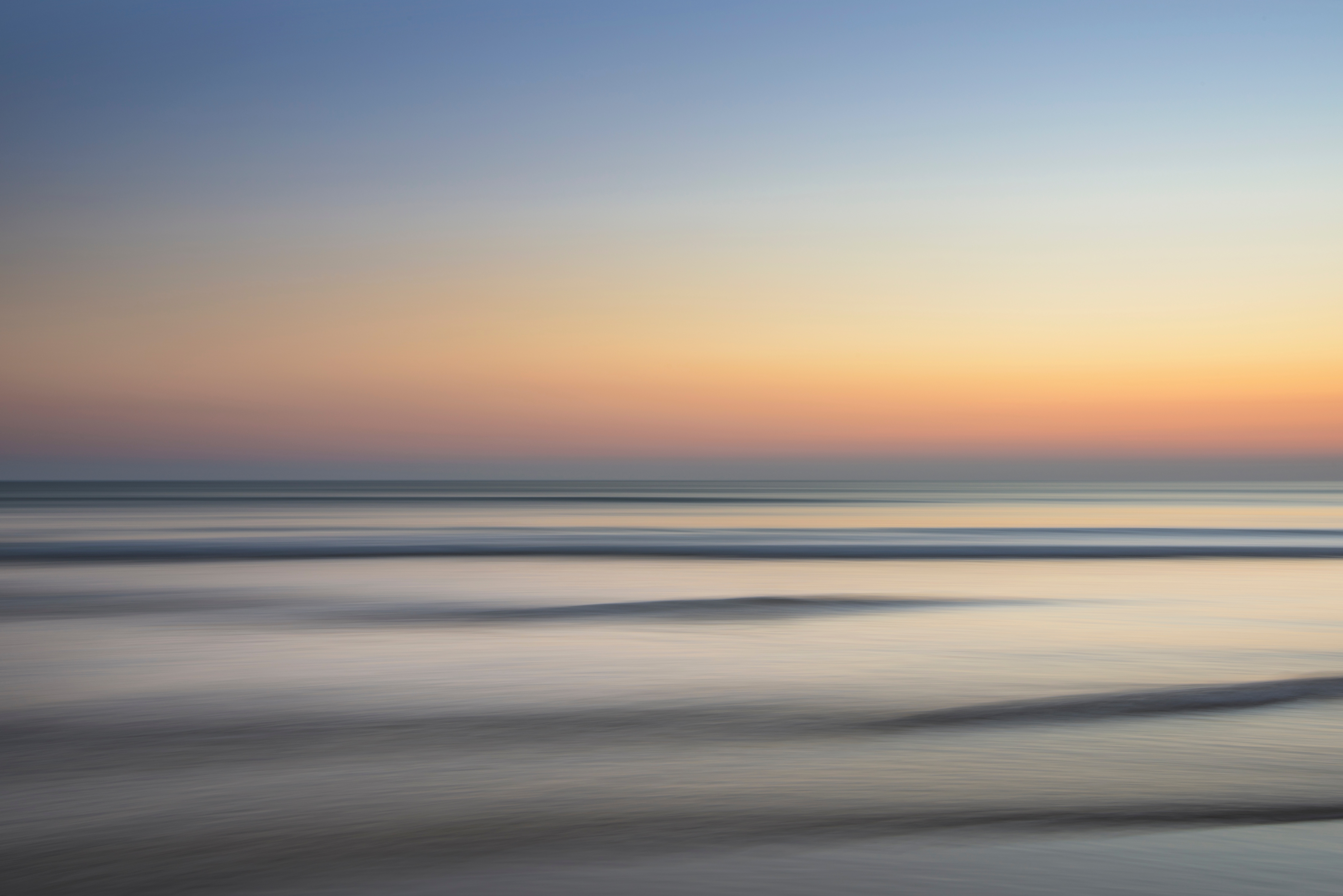 Minimalist sunset over the ocean with waves HD Wallpaper