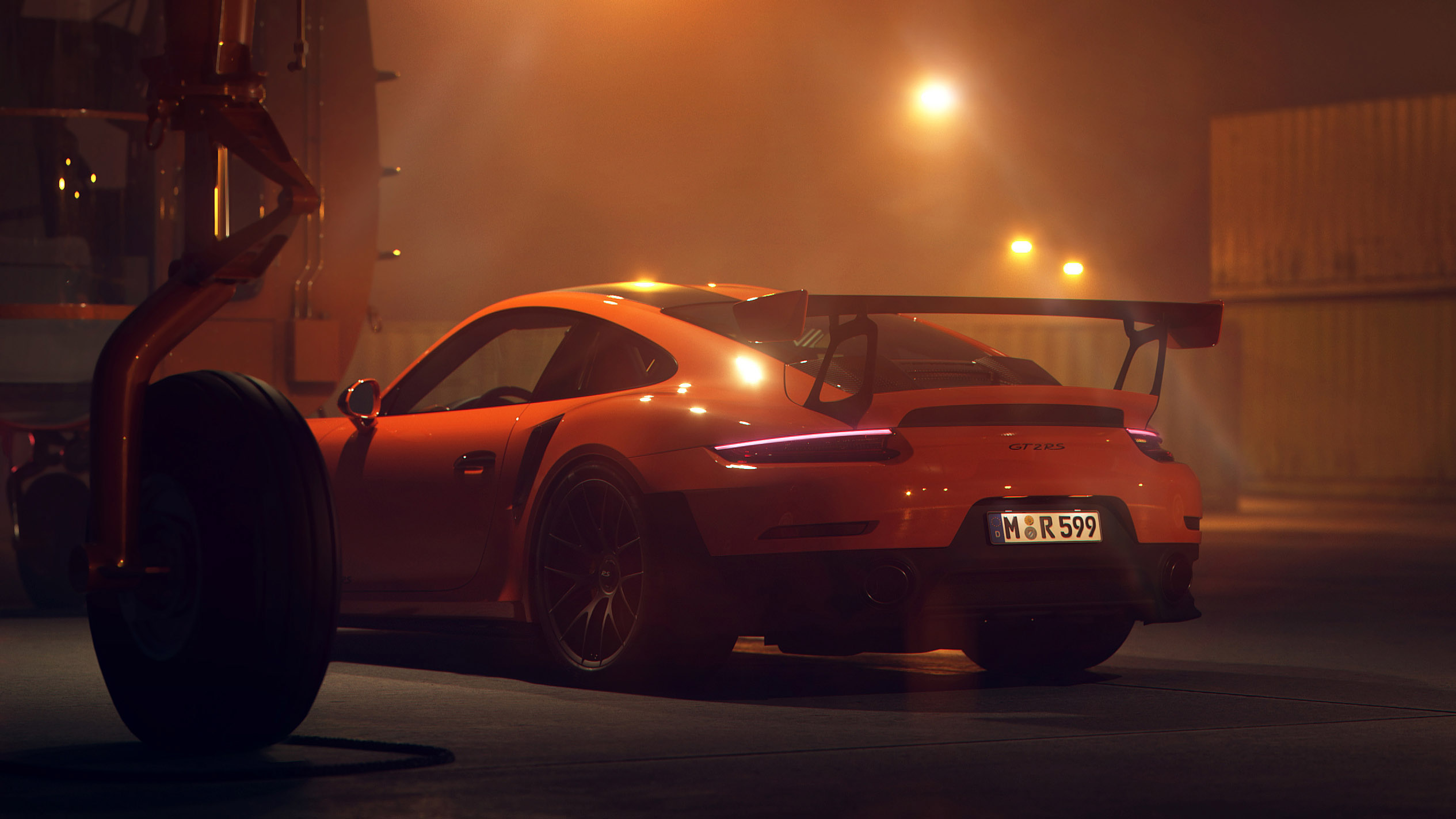 Orange Porsche 911 GT2 RS with a large rear spoiler HD Wallpaper