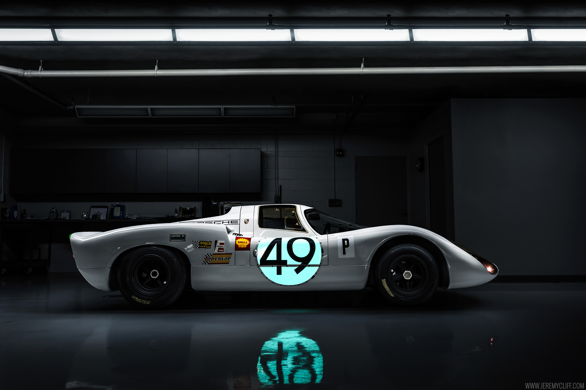 Porsche 907 race car in a garage HD Wallpaper
