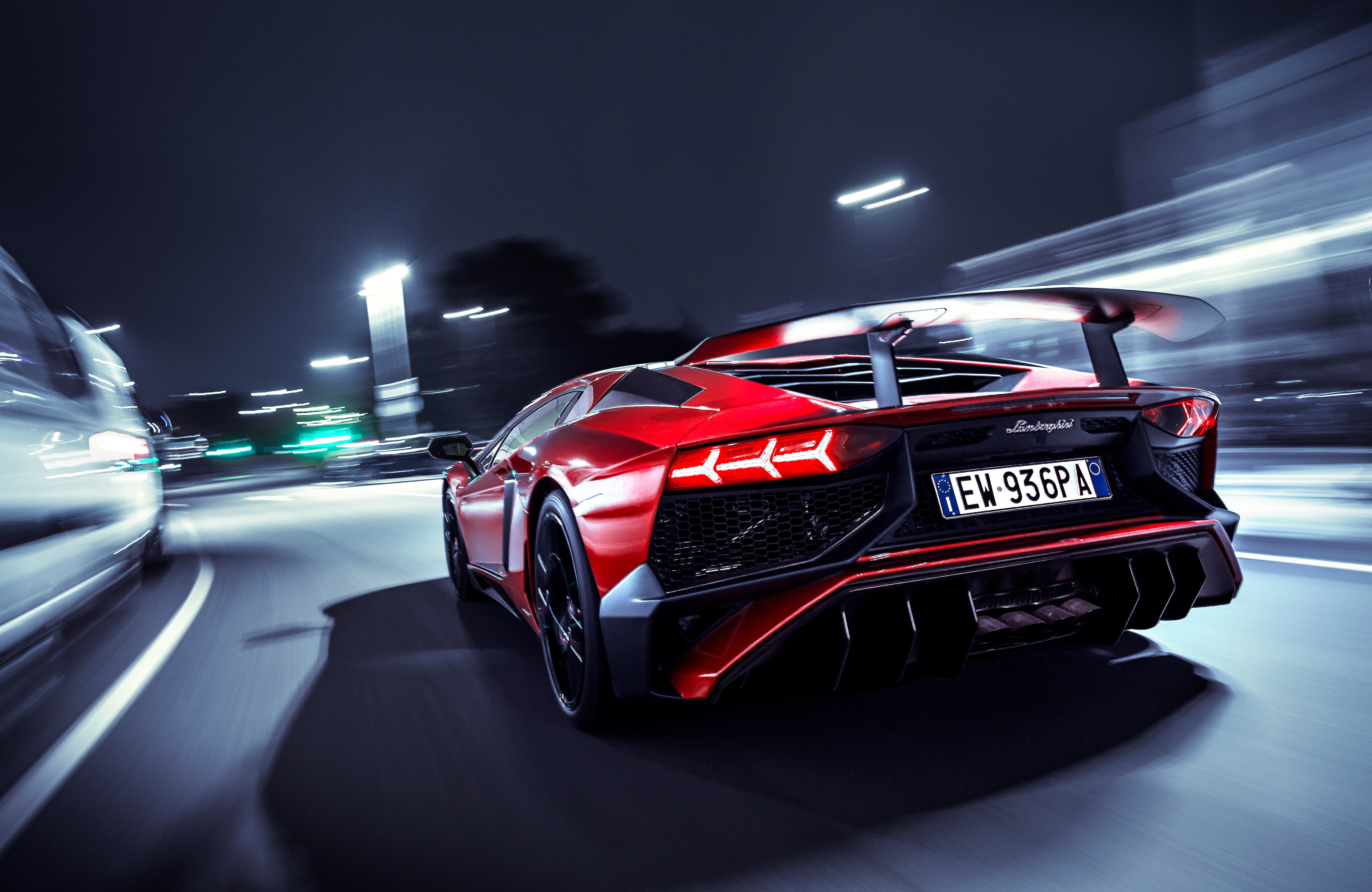 Red Lamborghini Aventador driving at night HD Wallpaper
