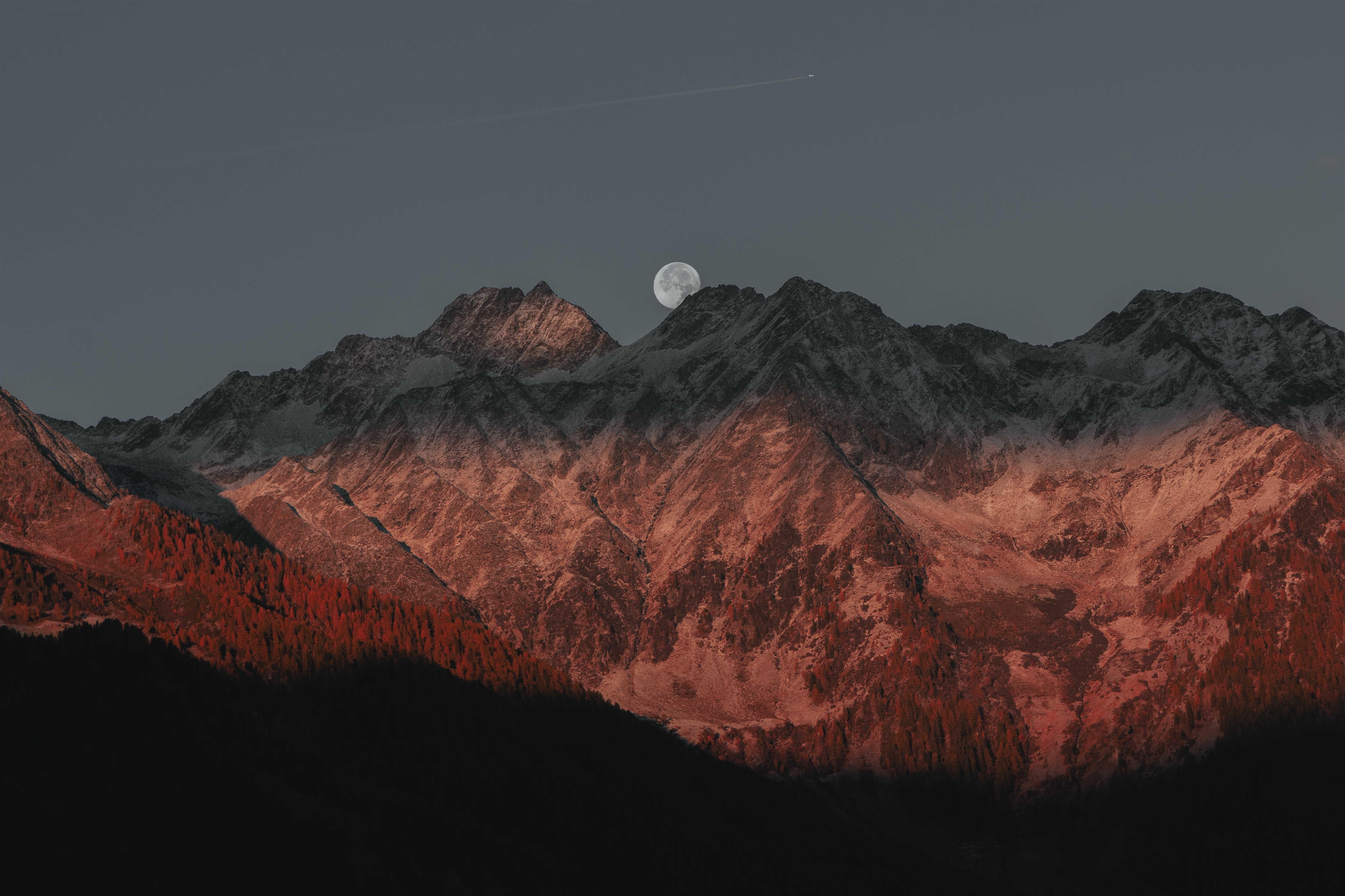 Moon over snow-capped mountains at sunset HD Wallpaper