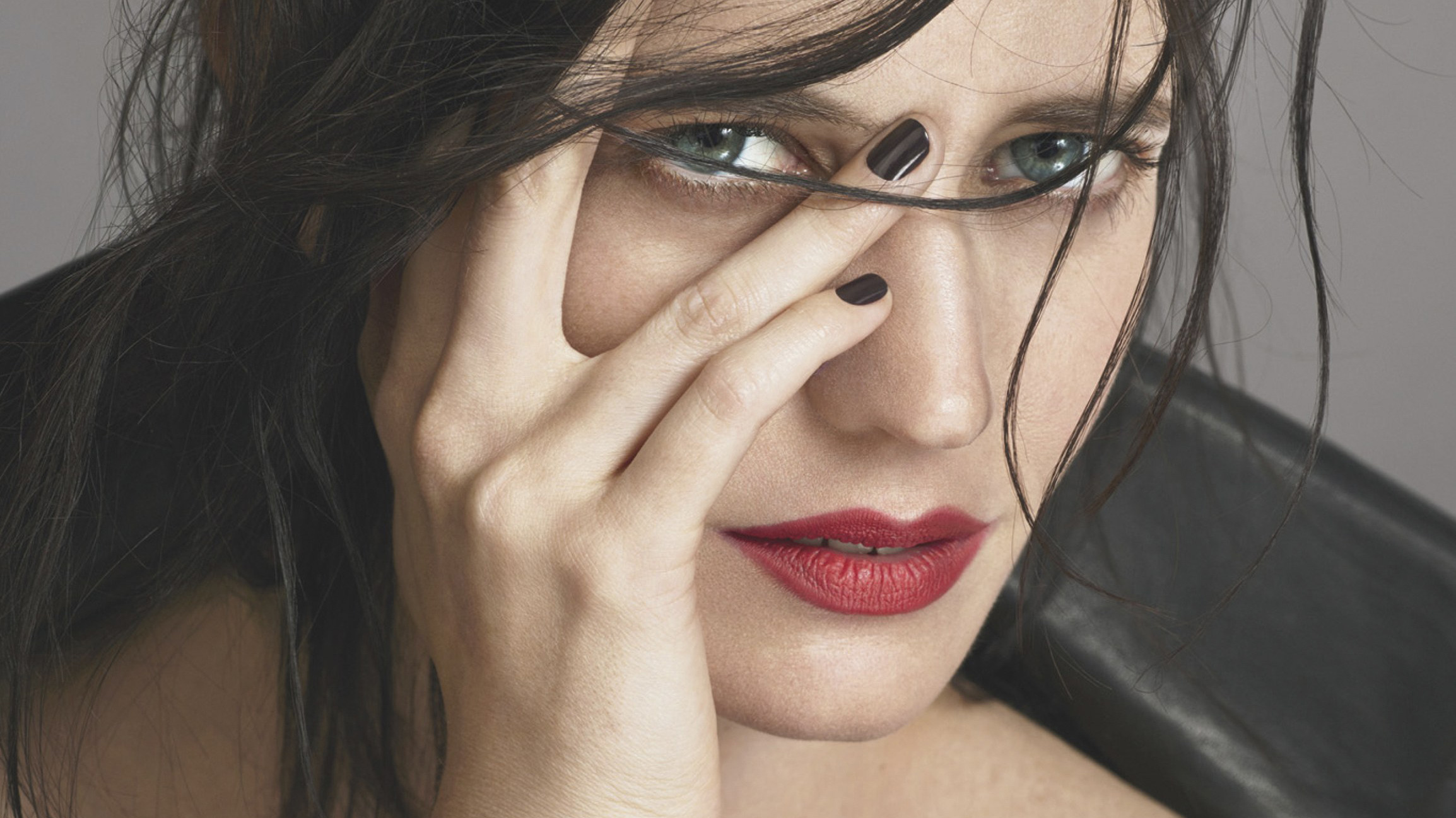 Eva Green close-up portrait with hand covering face HD Wallpaper