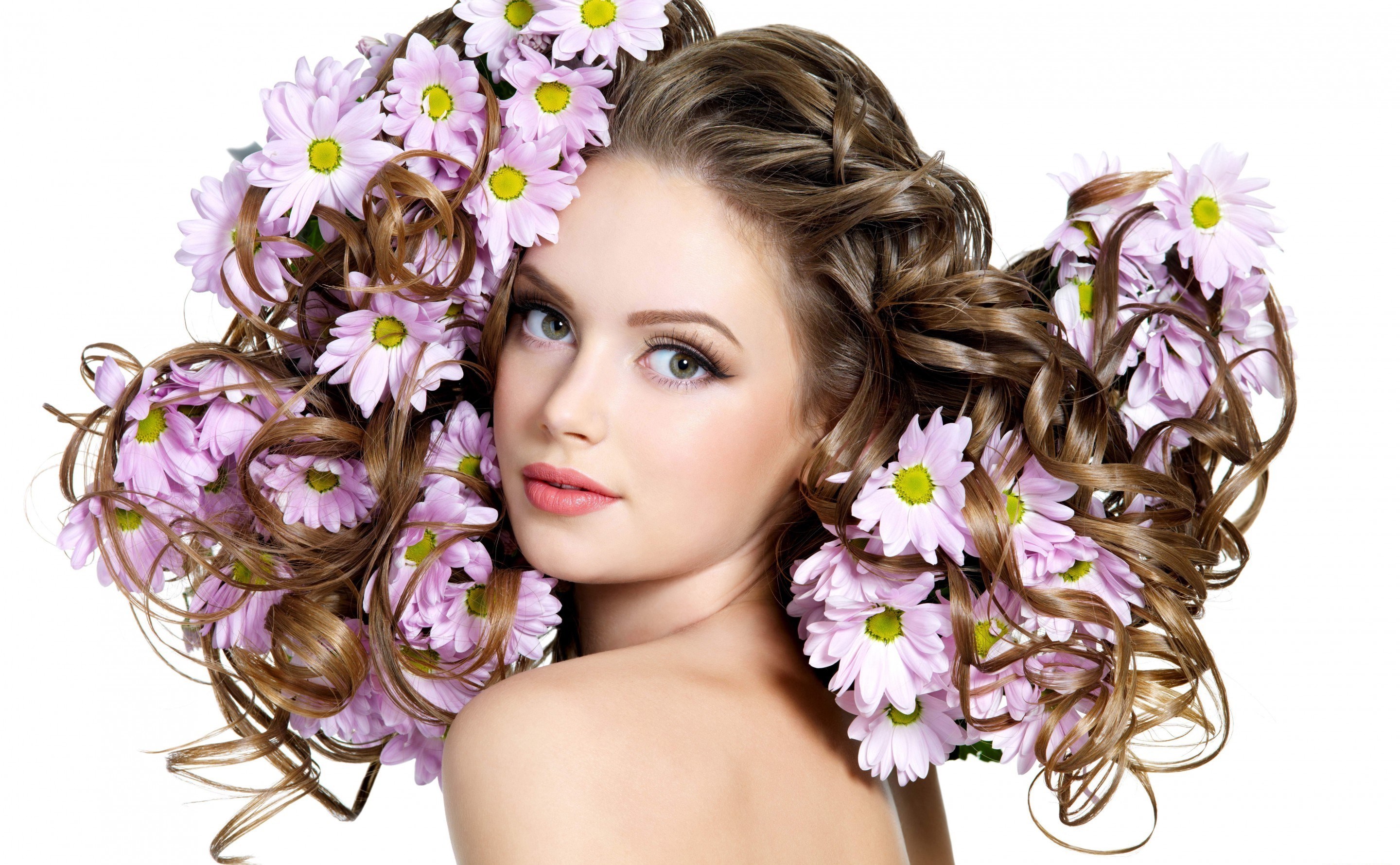 Woman with Curly Hair Adorned with Pink Flowers HD Wallpaper