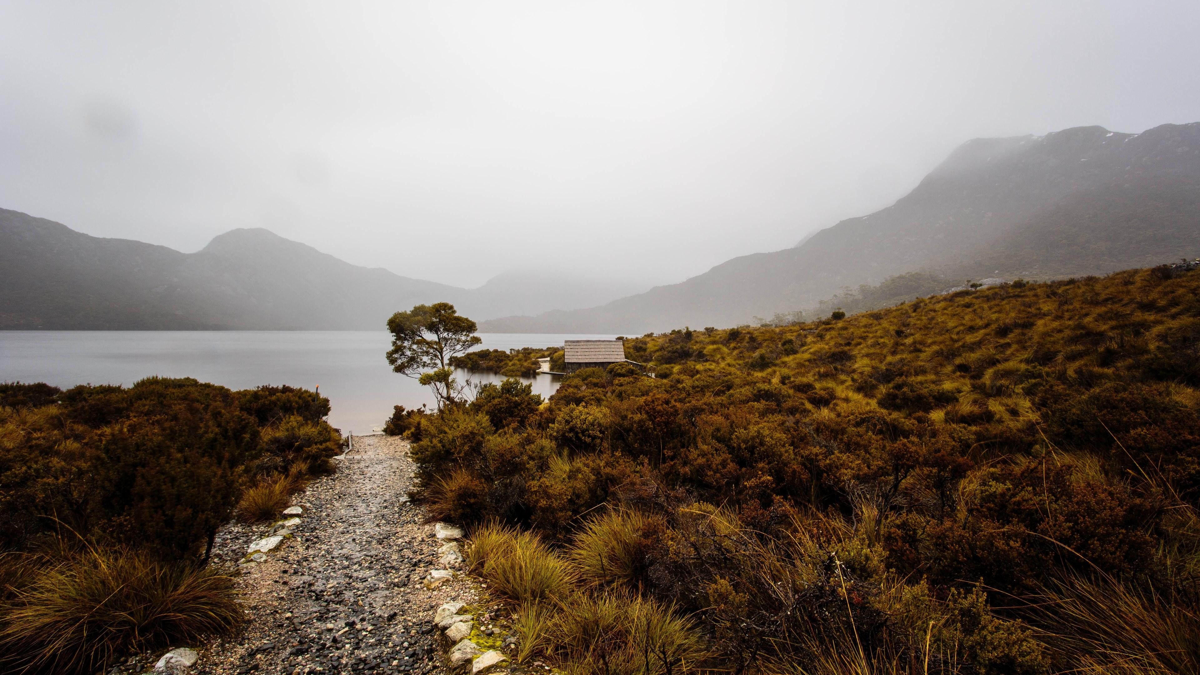 Lake and mountains with a small hut HD Wallpaper
