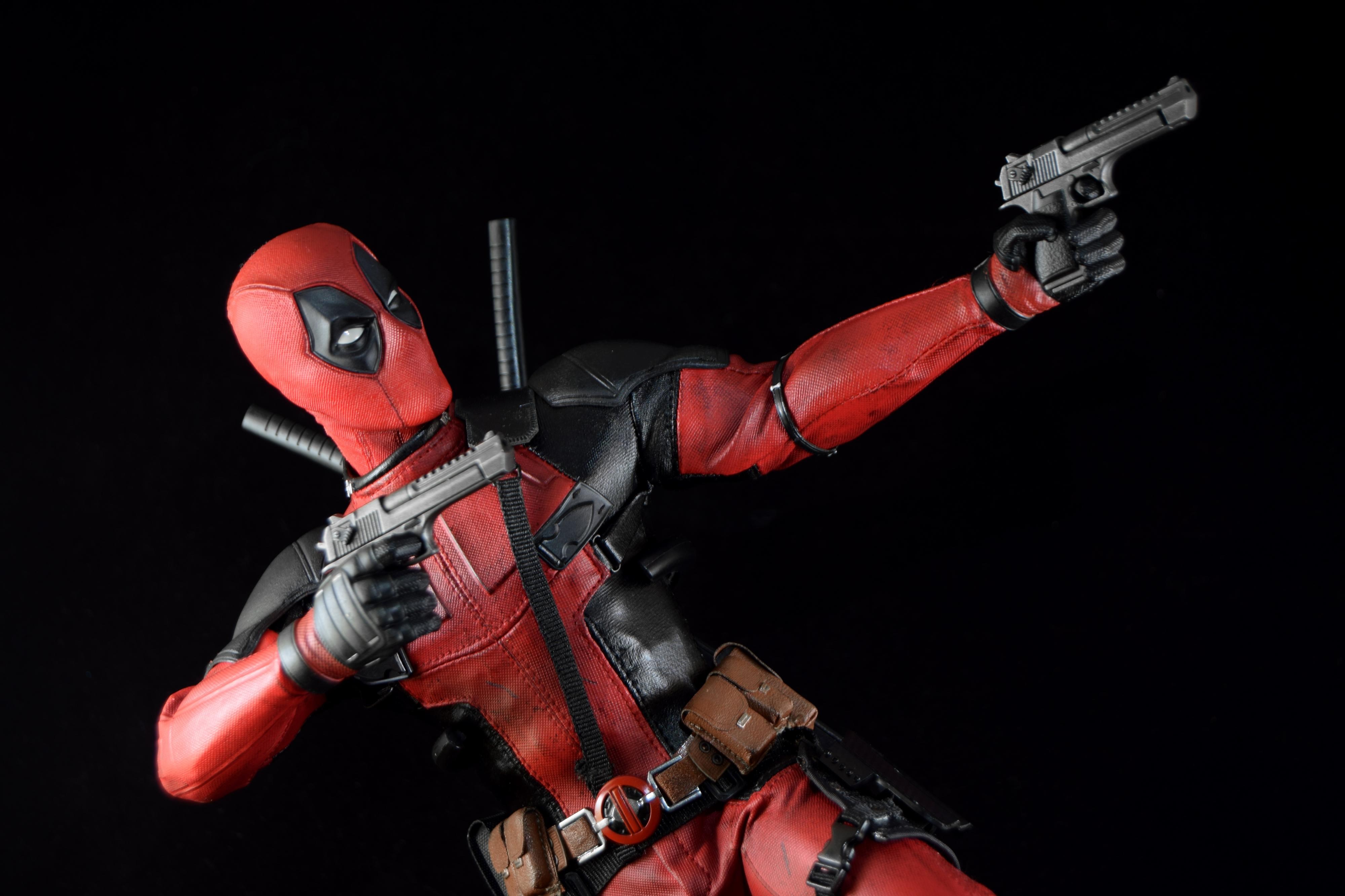 Deadpool action figure with guns HD Wallpaper