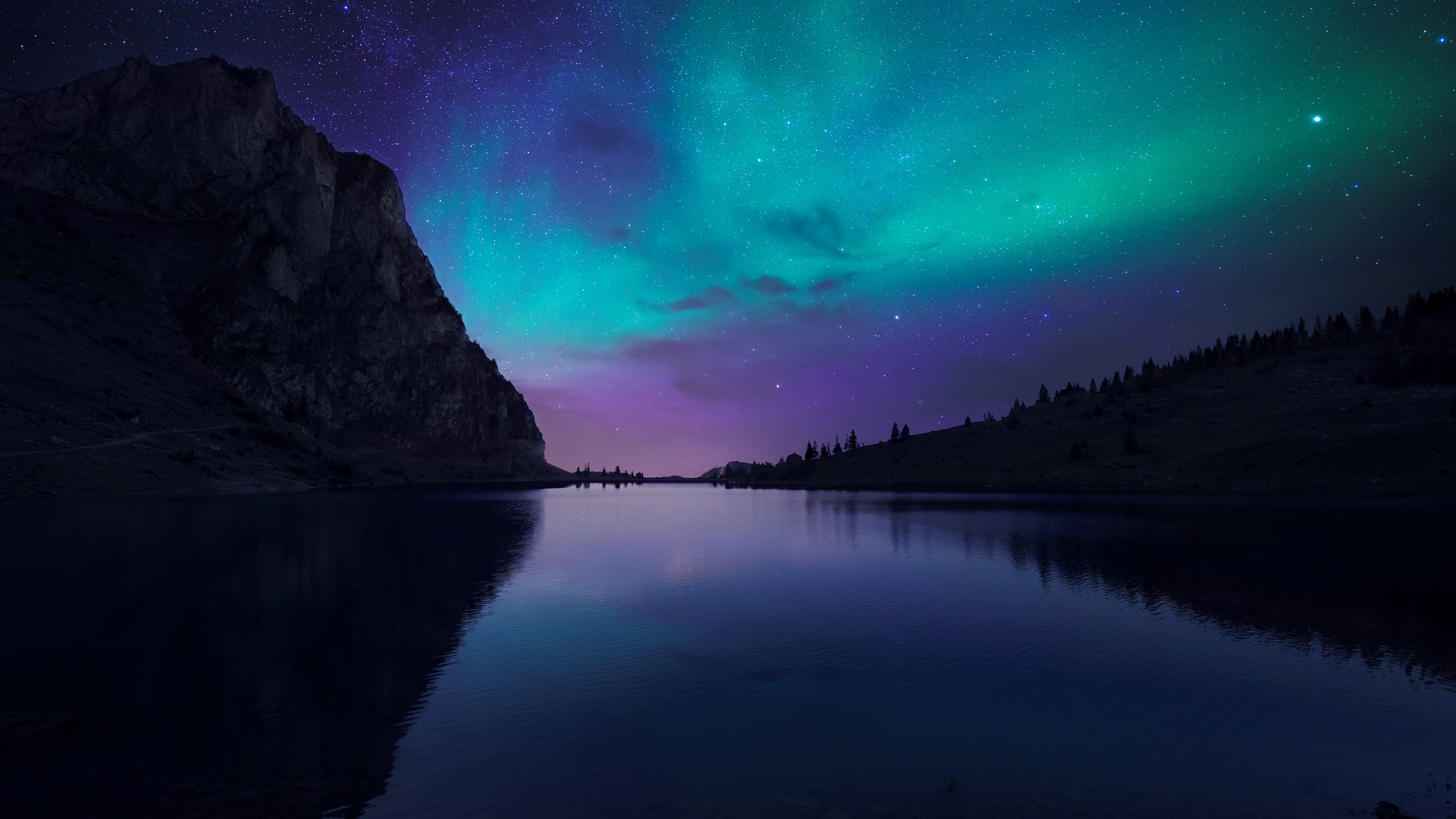 Aurora Borealis over a lake and mountains HD Wallpaper