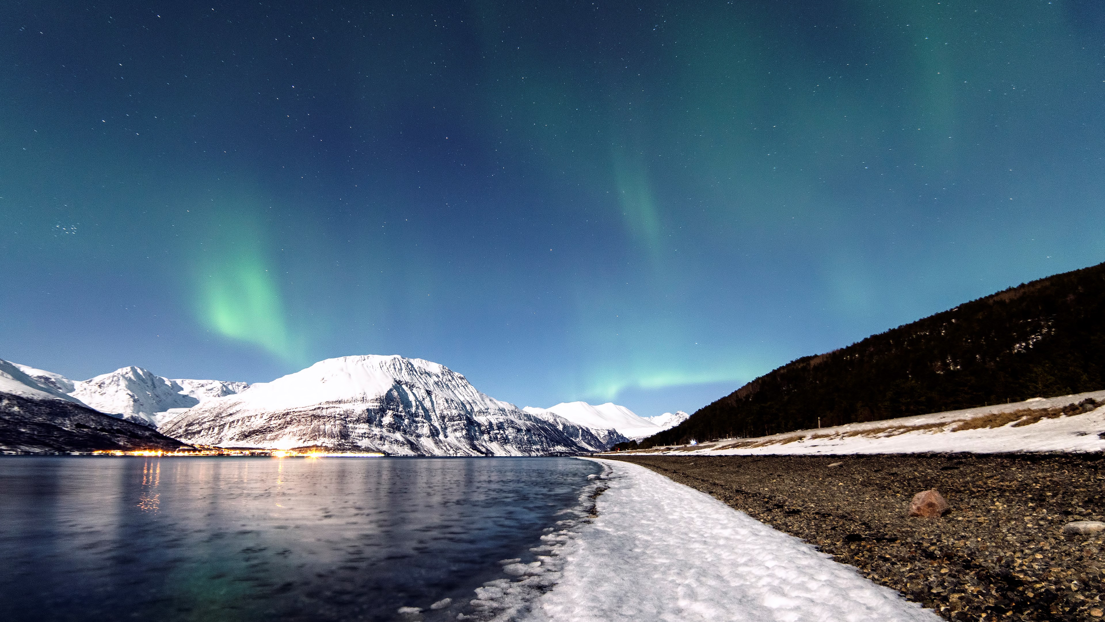 Aurora Borealis over snow-capped mountains and a lake HD Wallpaper