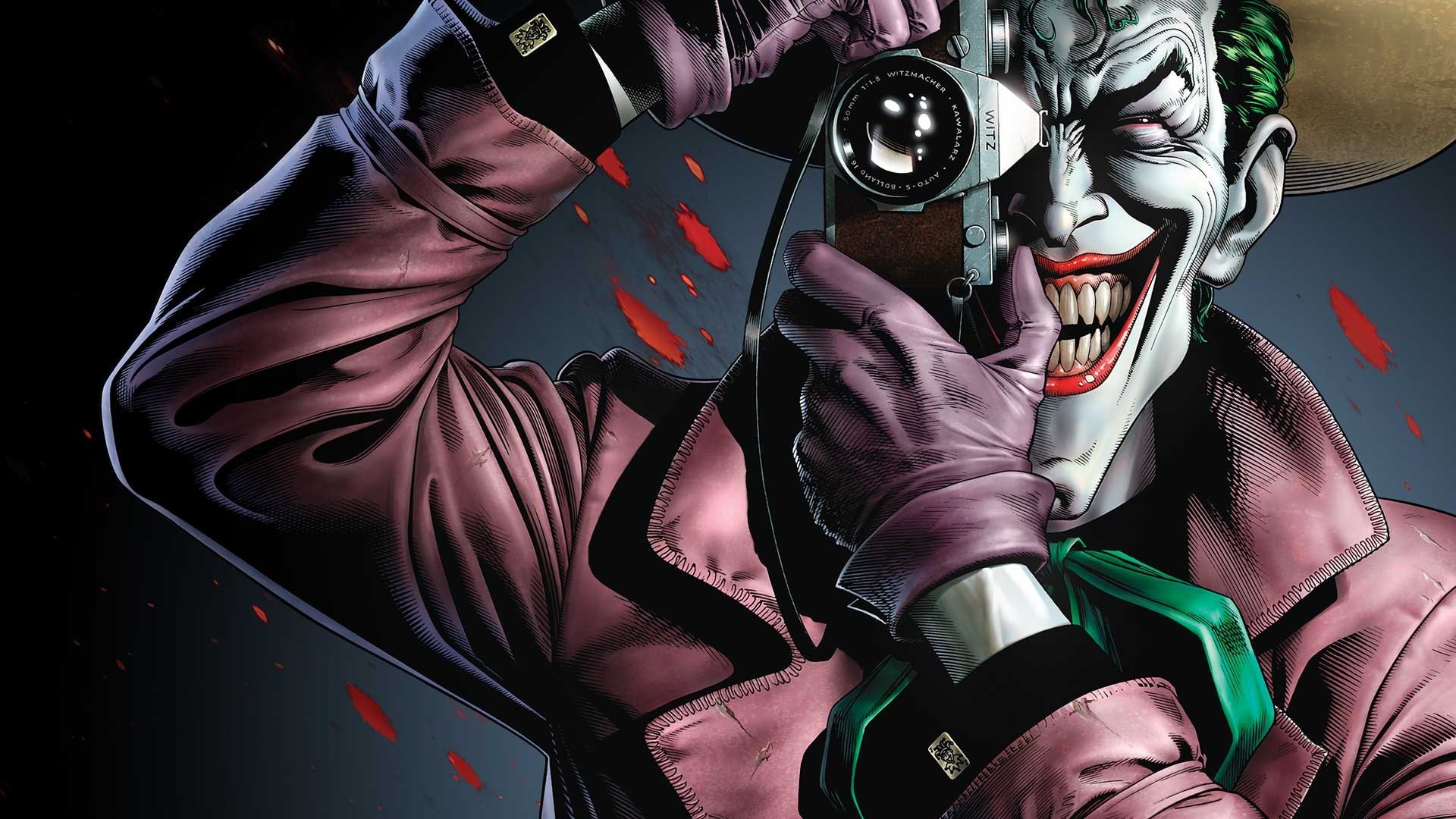 Joker Smiling in Dark Attire with Camera HD Wallpaper