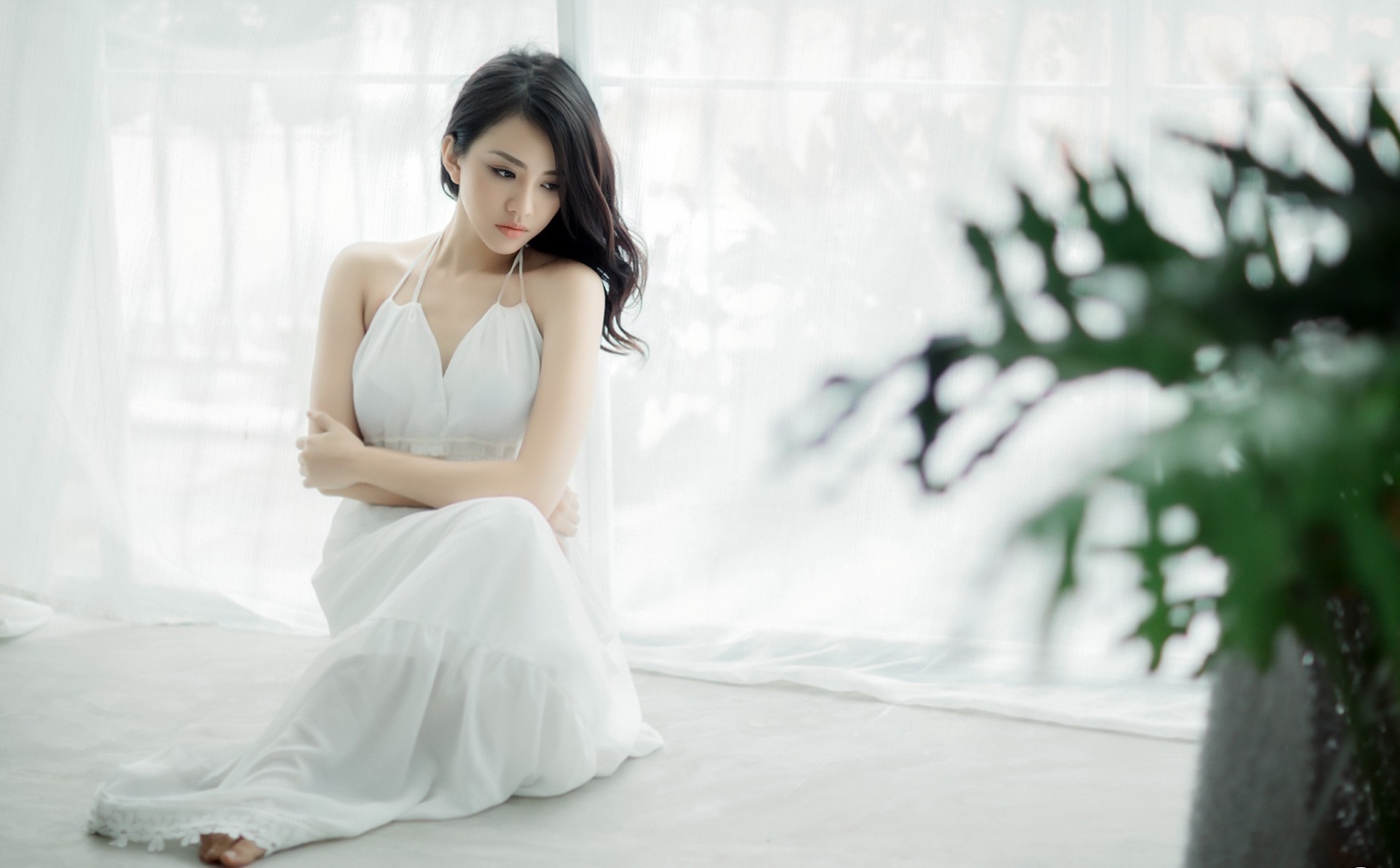 Asian woman in white dress sitting by window HD Wallpaper