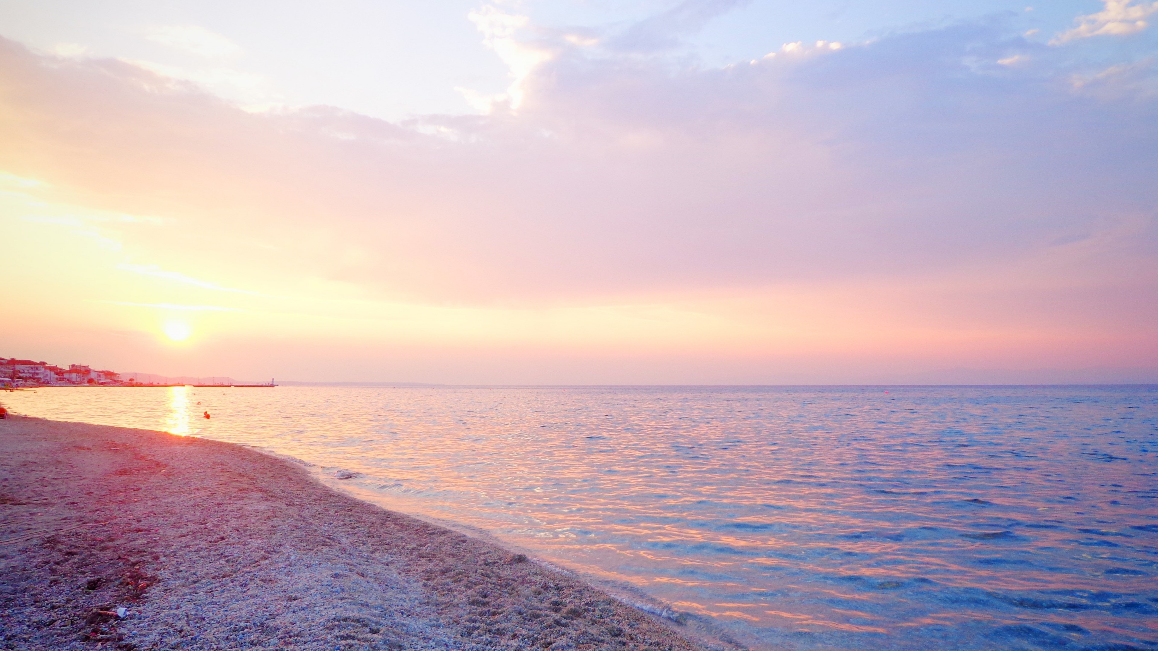 Sunset over the sea with a beach HD Wallpaper
