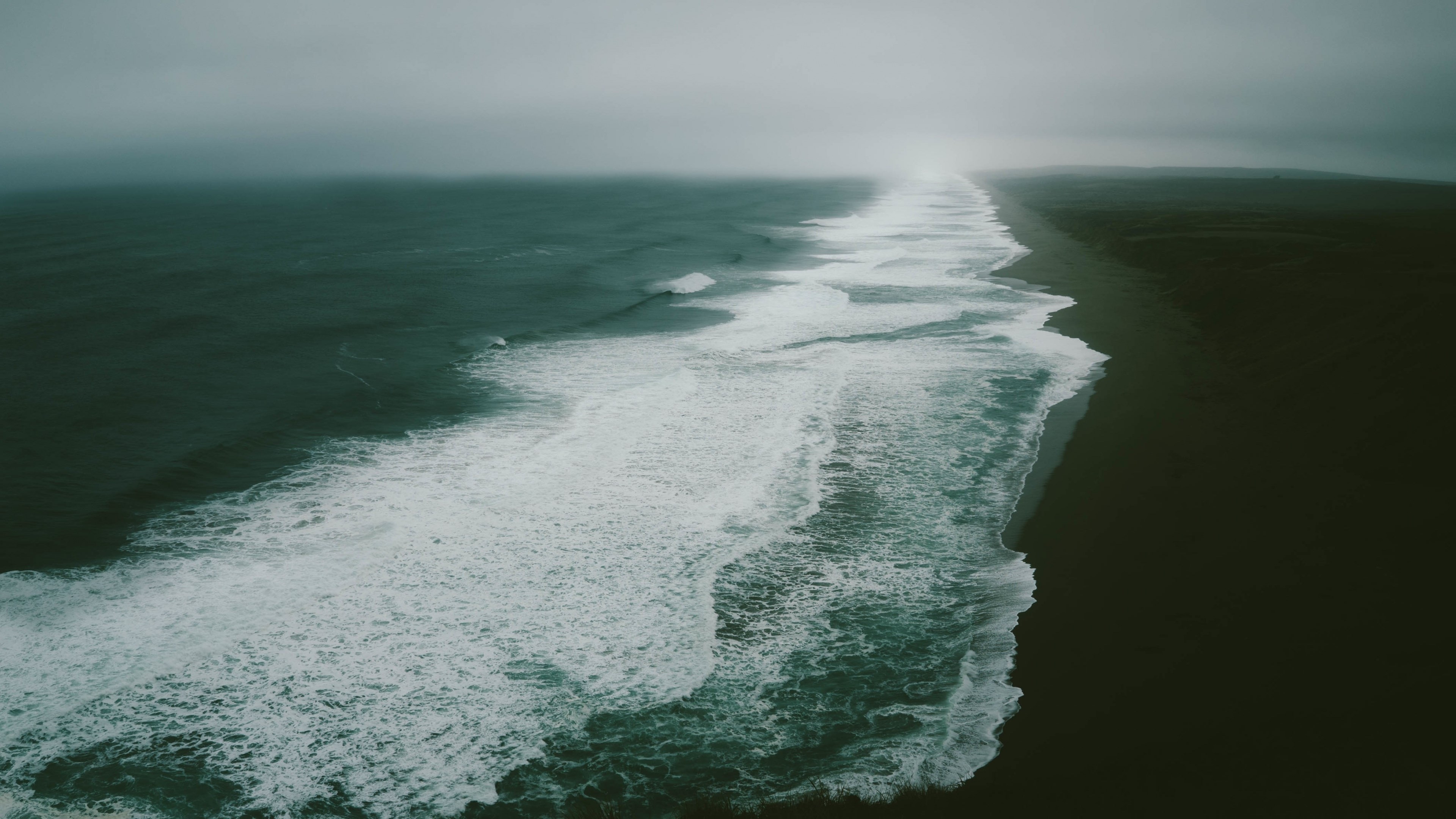 Ocean waves on a dark beach 4K HD Wallpaper
