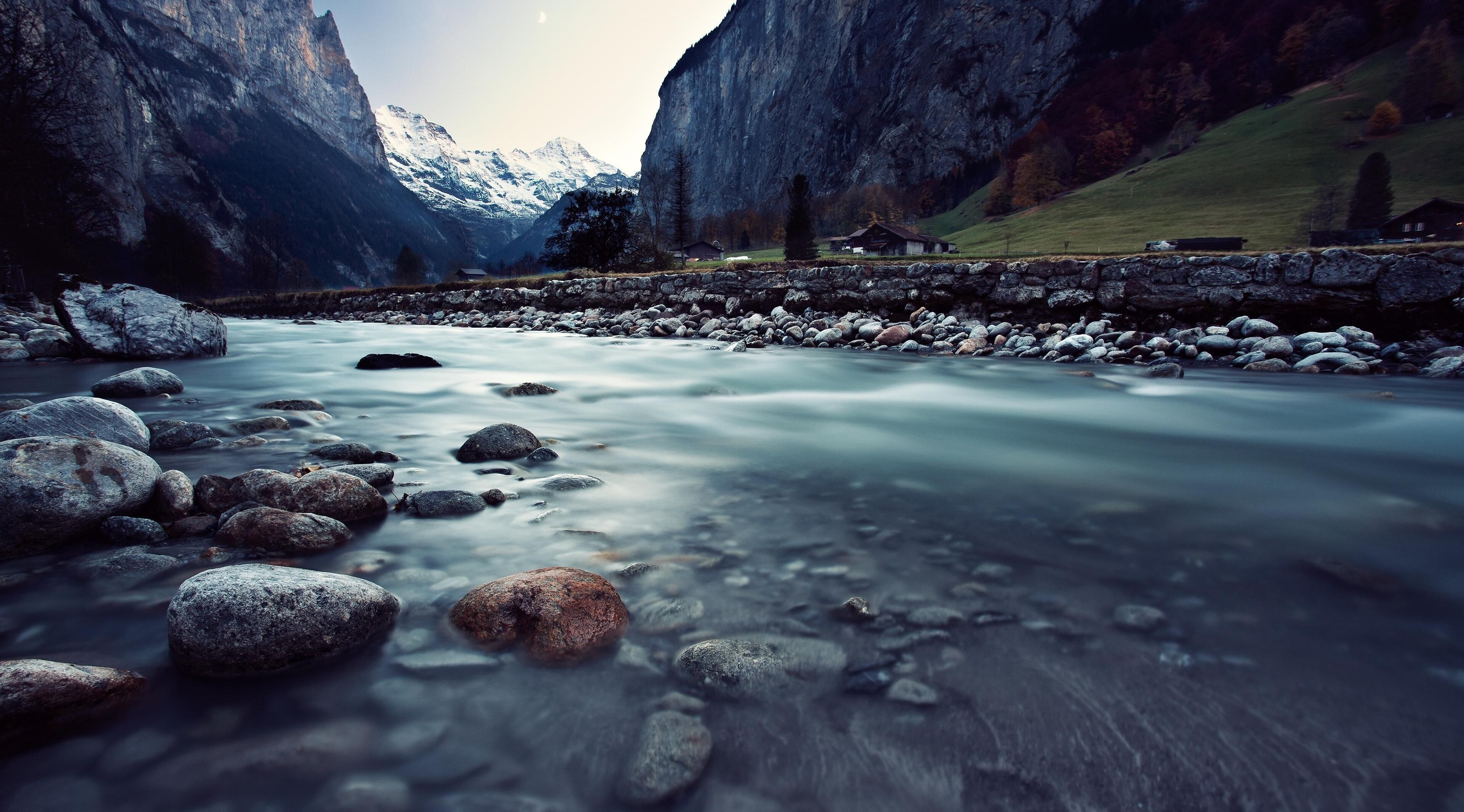 River flowing through mountains in Switzerland 4K HD Wallpaper