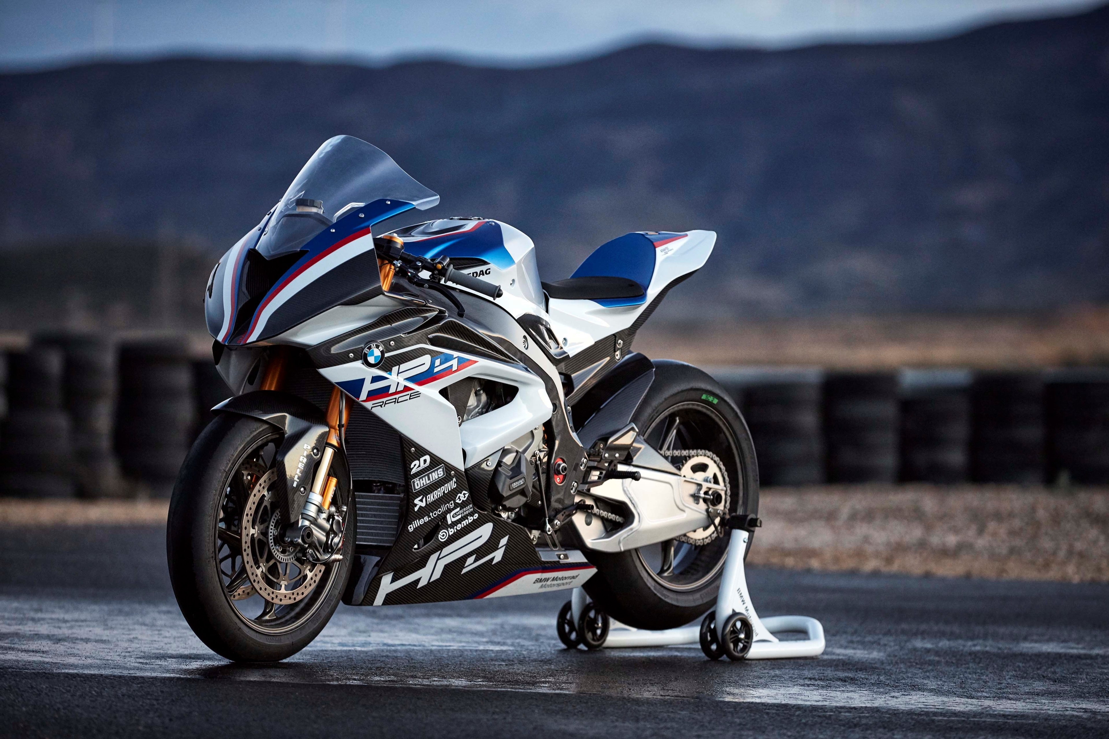 BMW HP4 Race motorcycle on a track HD Wallpaper