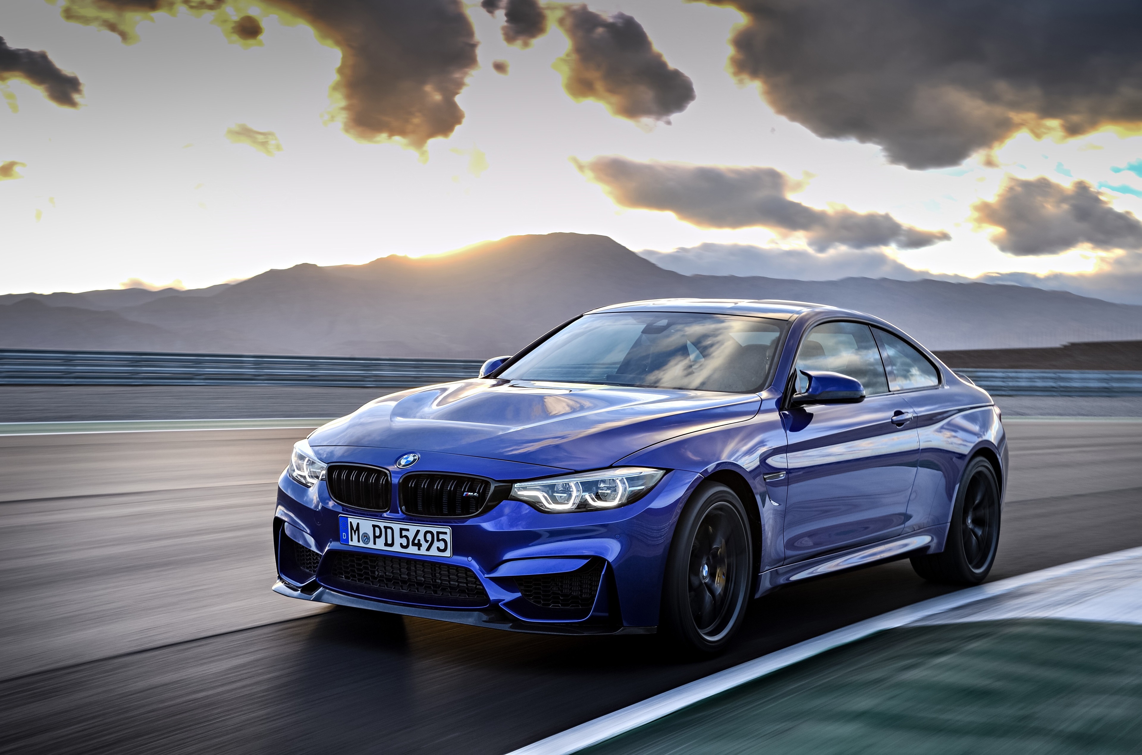 Blue BMW M4 CS on a race track HD Wallpaper