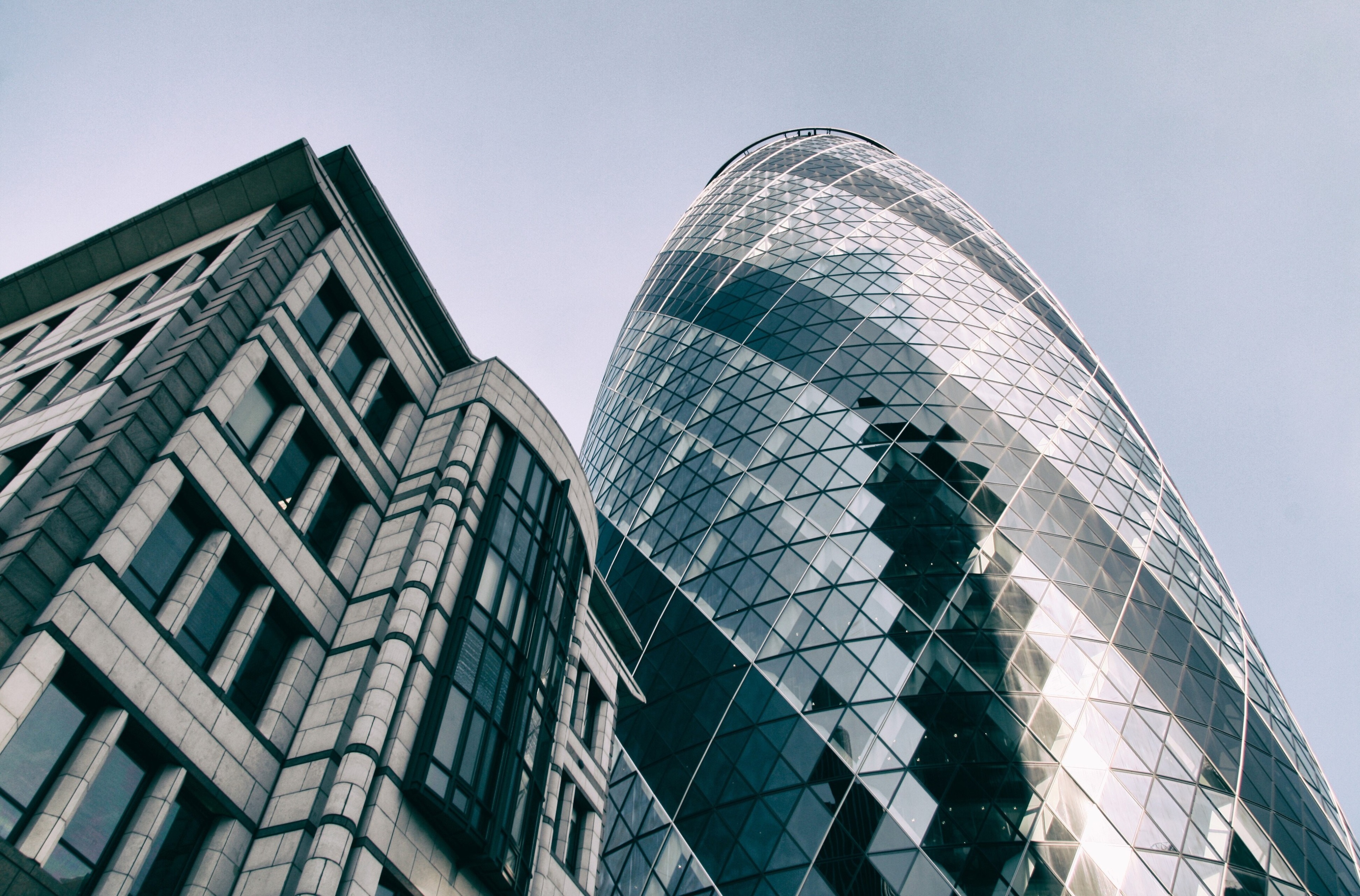 The Gherkin Building and adjacent office building HD Wallpaper