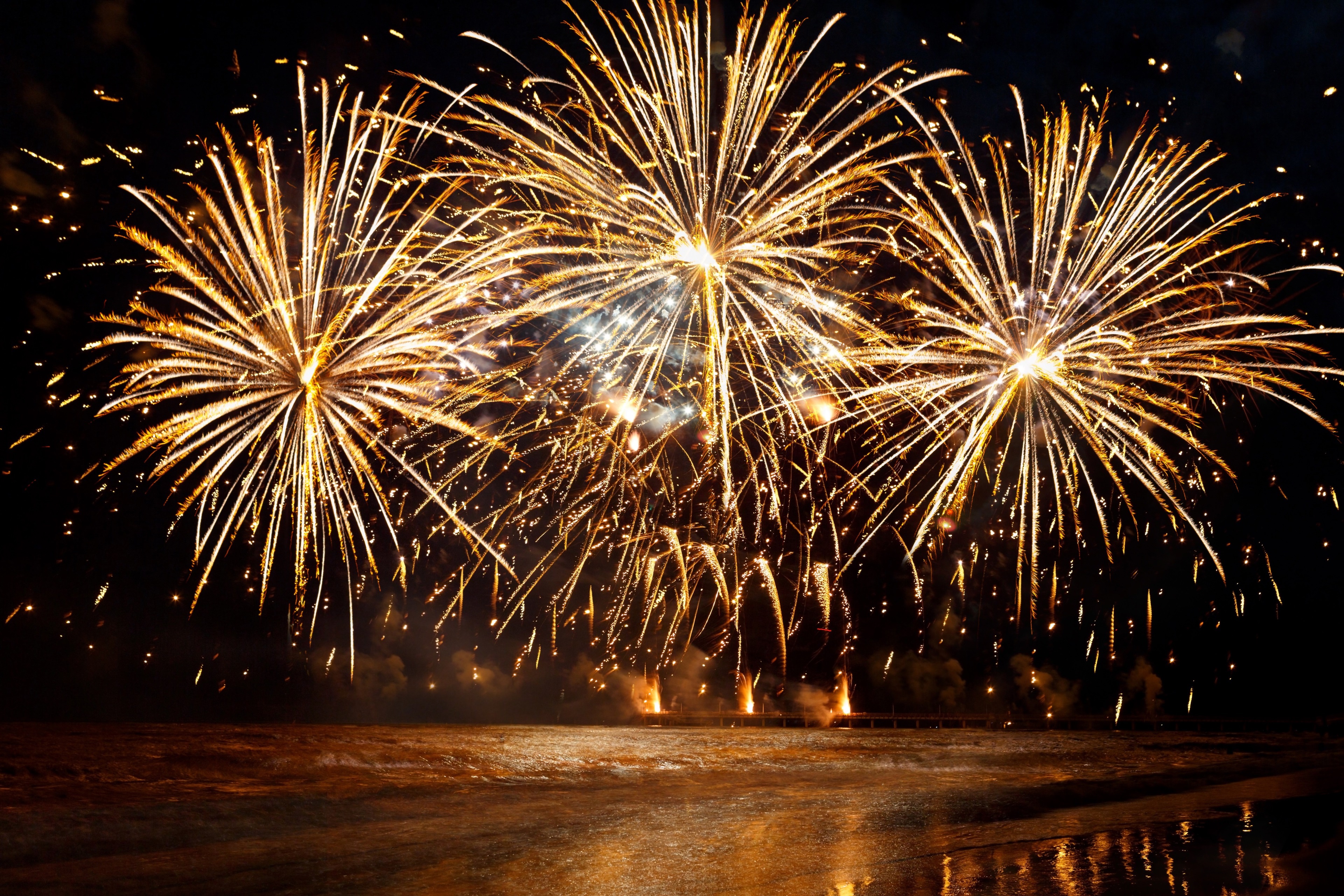 Vibrant 4K Fireworks Display Over Water HD Wallpaper