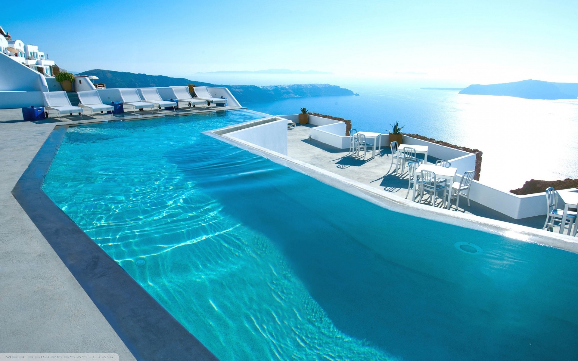 Luxury infinity pool overlooking the sea in Santorini HD Wallpaper
