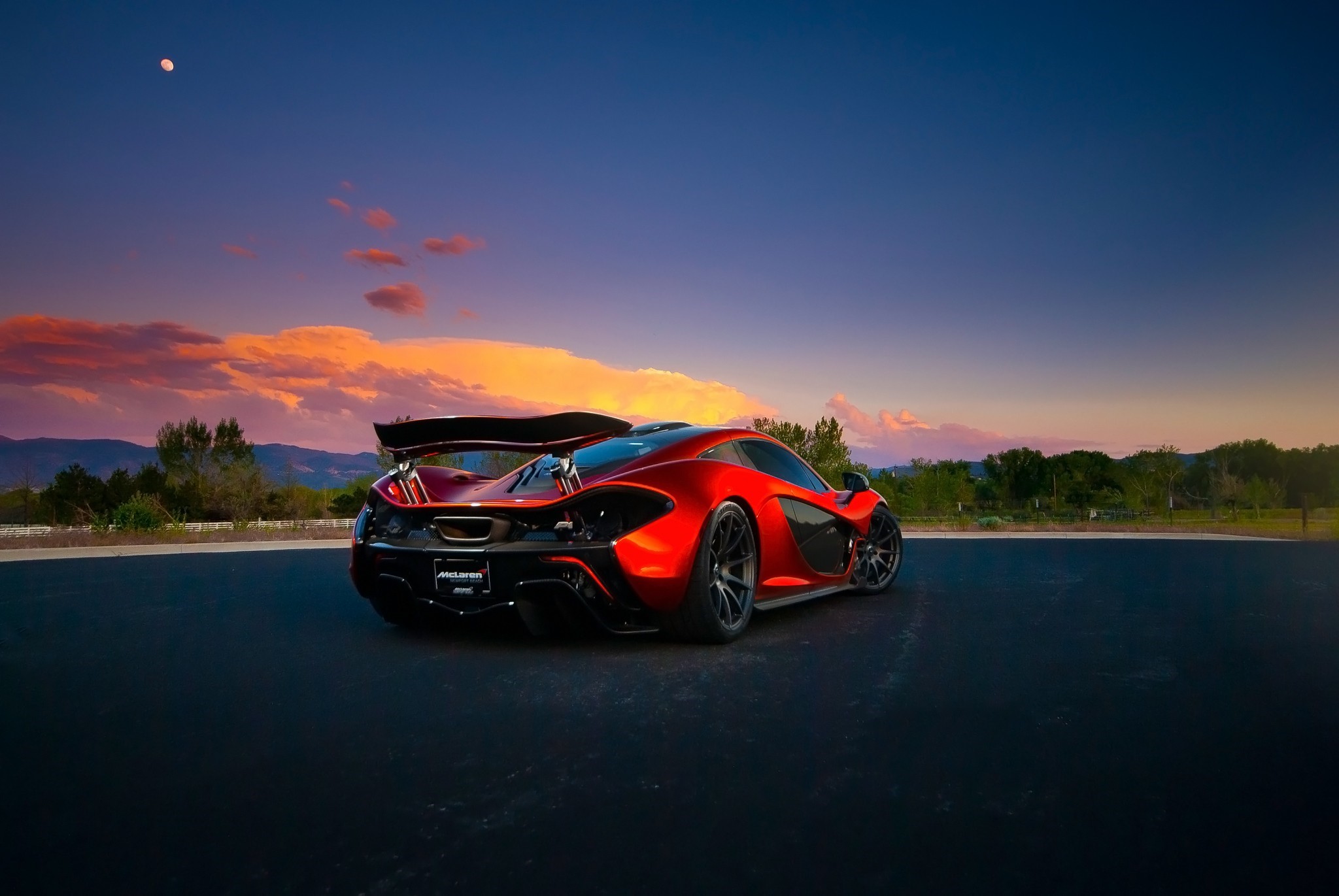 Red McLaren P1 sports car at sunset HD Wallpaper