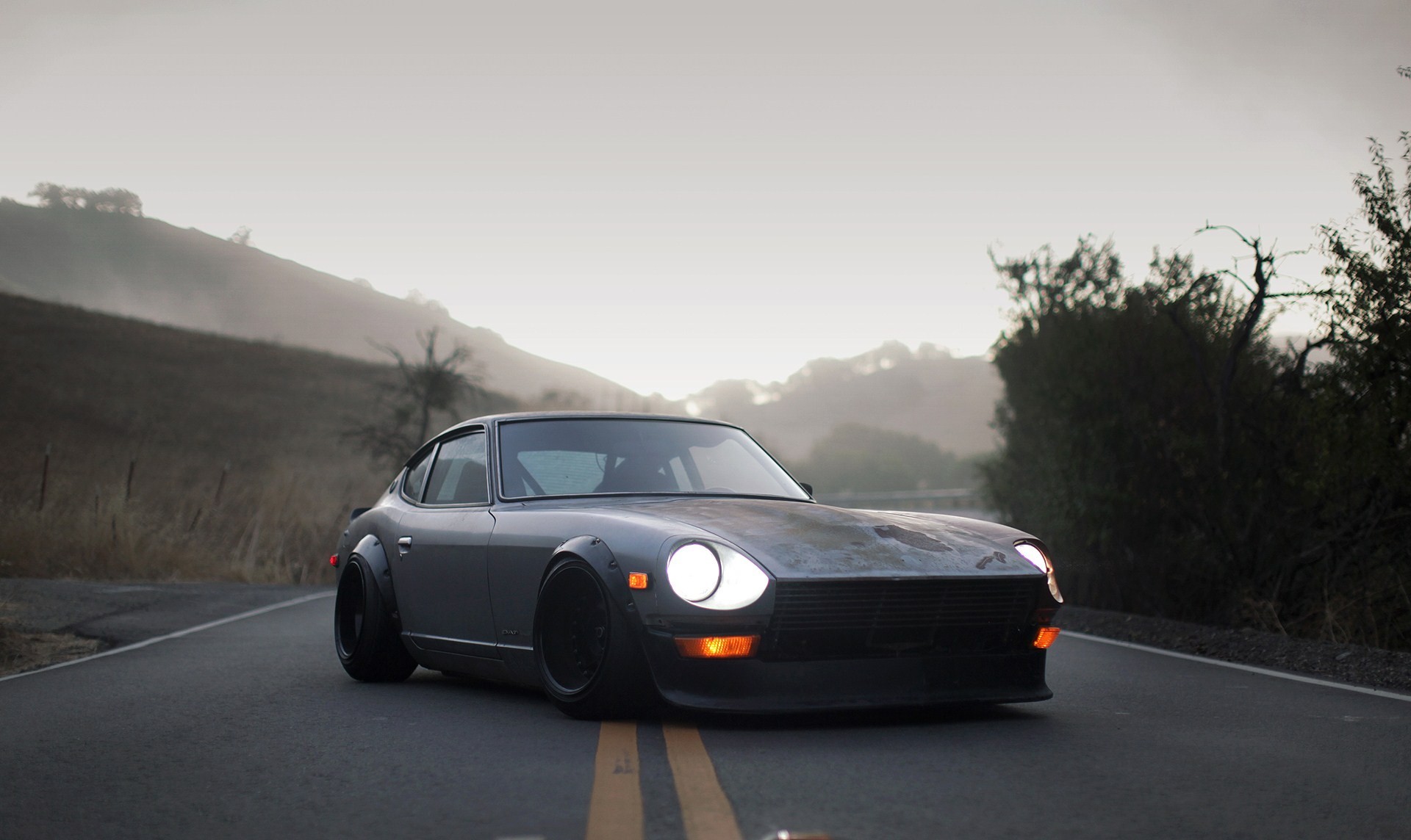 Modified Datsun 240Z on a foggy road HD Wallpaper