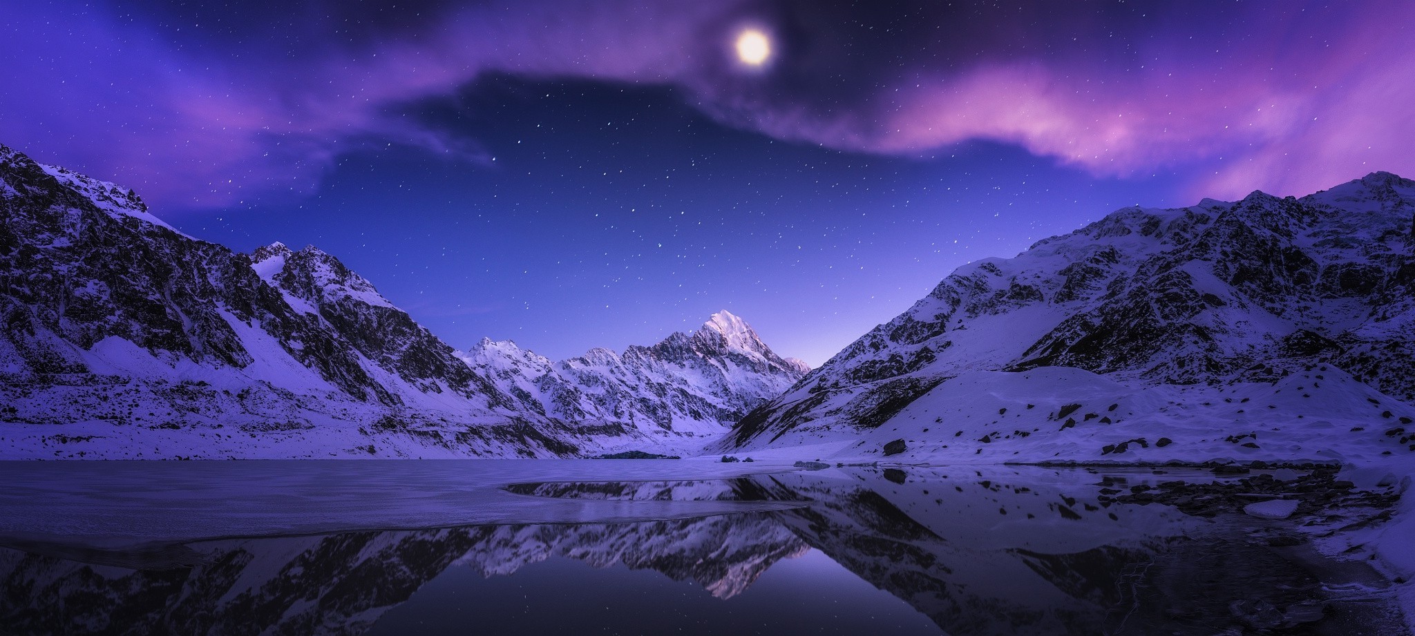 Snowy Mountains Reflecting in a Lake Under a Starry Night Sky HD Wallpaper