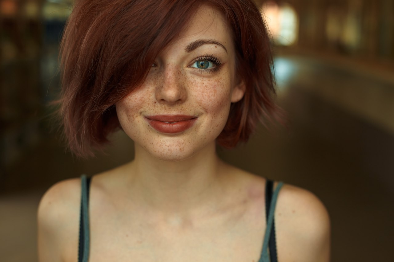 Redhead woman with freckles and green eyes looking at viewer HD Wallpaper