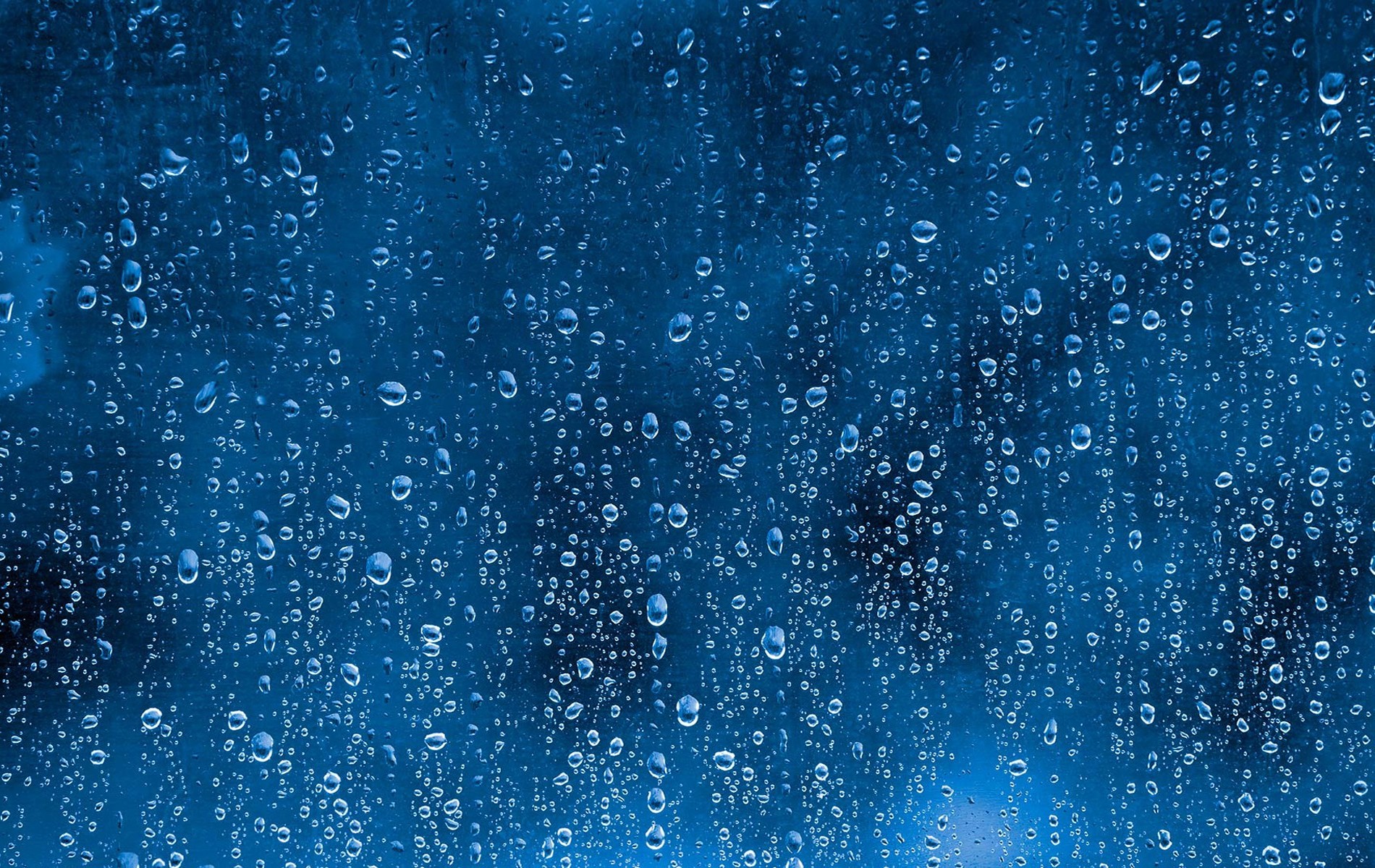Water drops on a blue textured surface HD Wallpaper