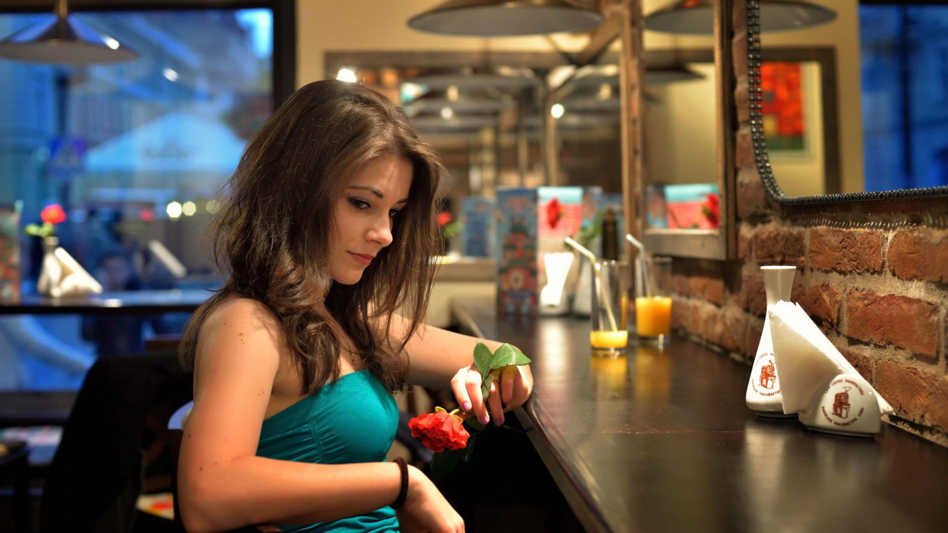 Woman holding a red rose at a bar HD Wallpaper