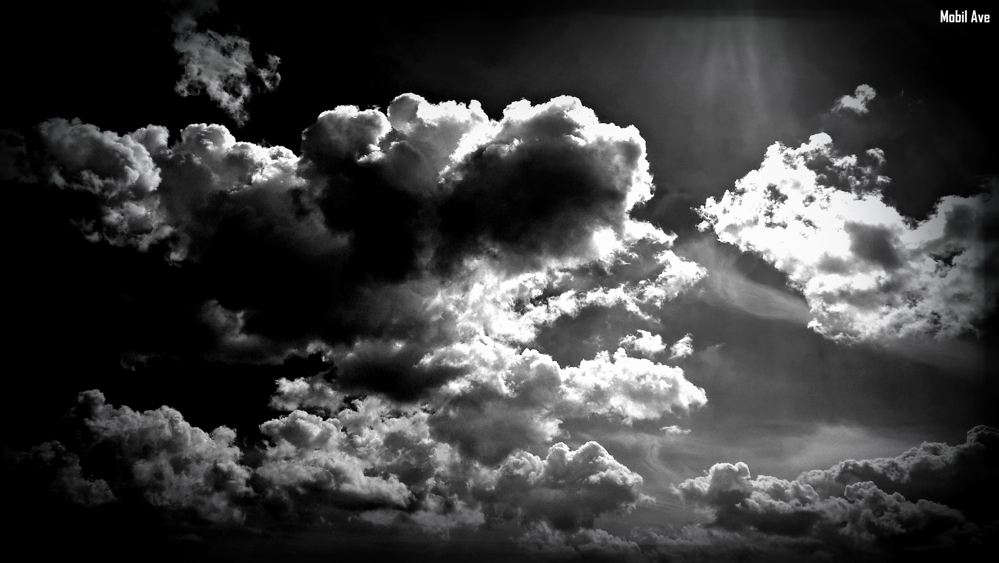 Dark clouds in a monochrome sky HD Wallpaper