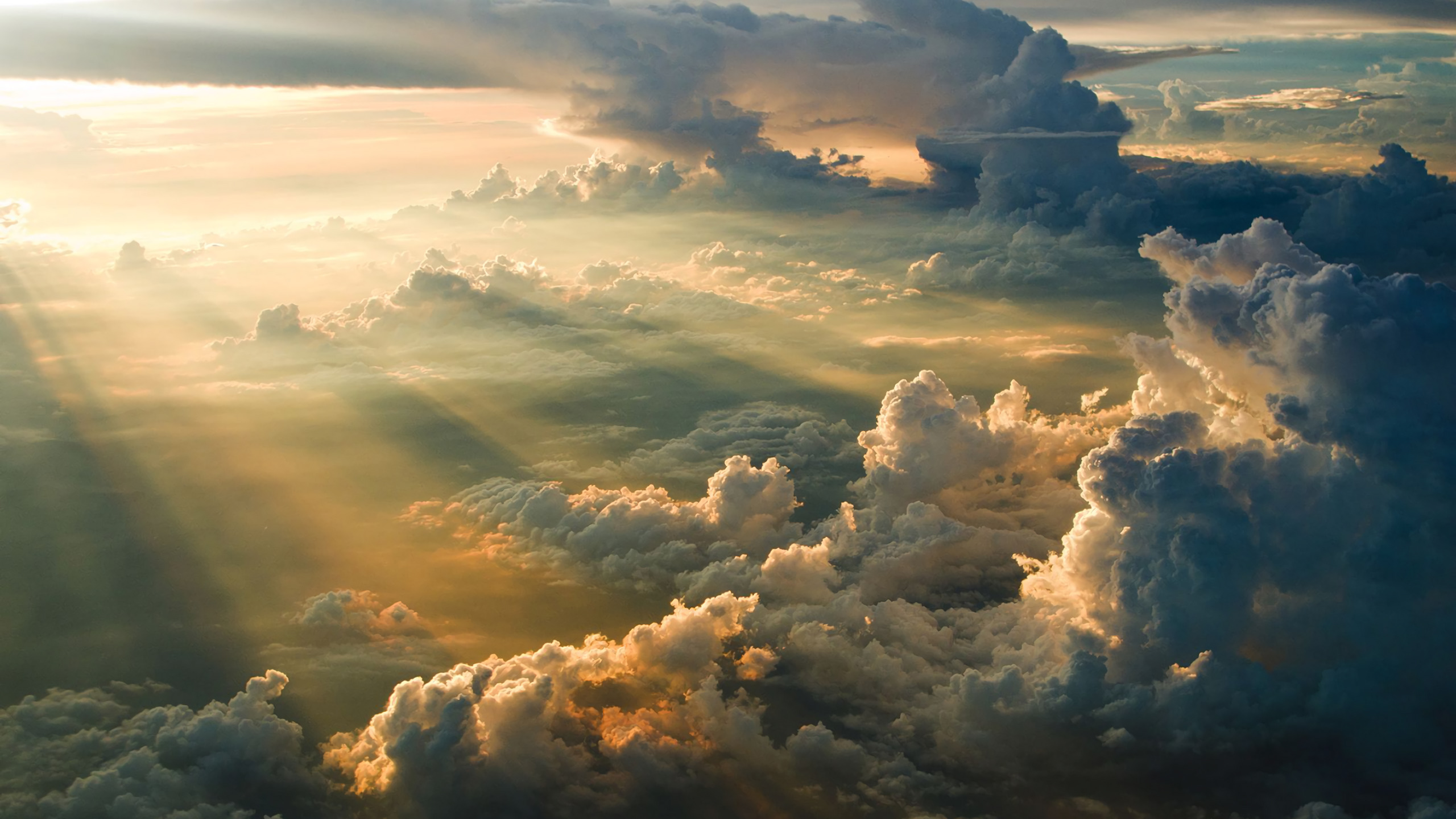 Golden Sun Rays Breaking Through Dramatic Clouds HD Wallpaper