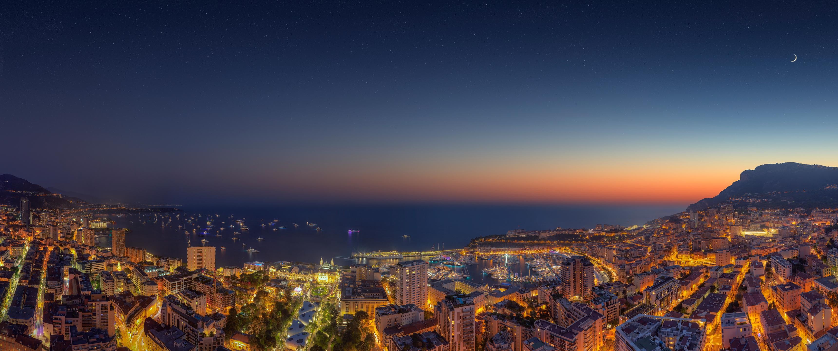 Ultrawide panoramic view of Monaco cityscape at dusk HD Wallpaper