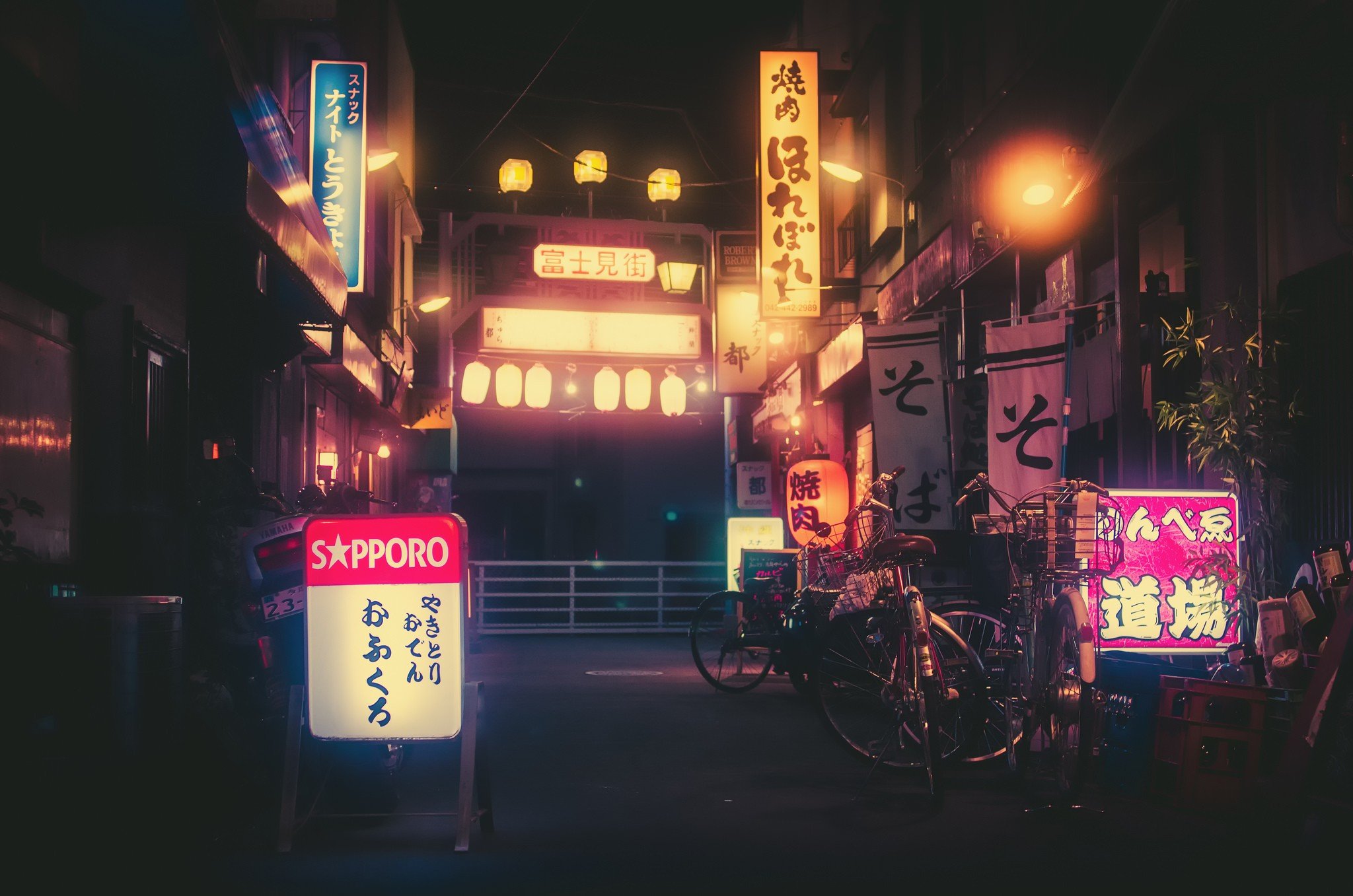 Japanese Street at Night with Neon Signs and Bicycles HD Wallpaper