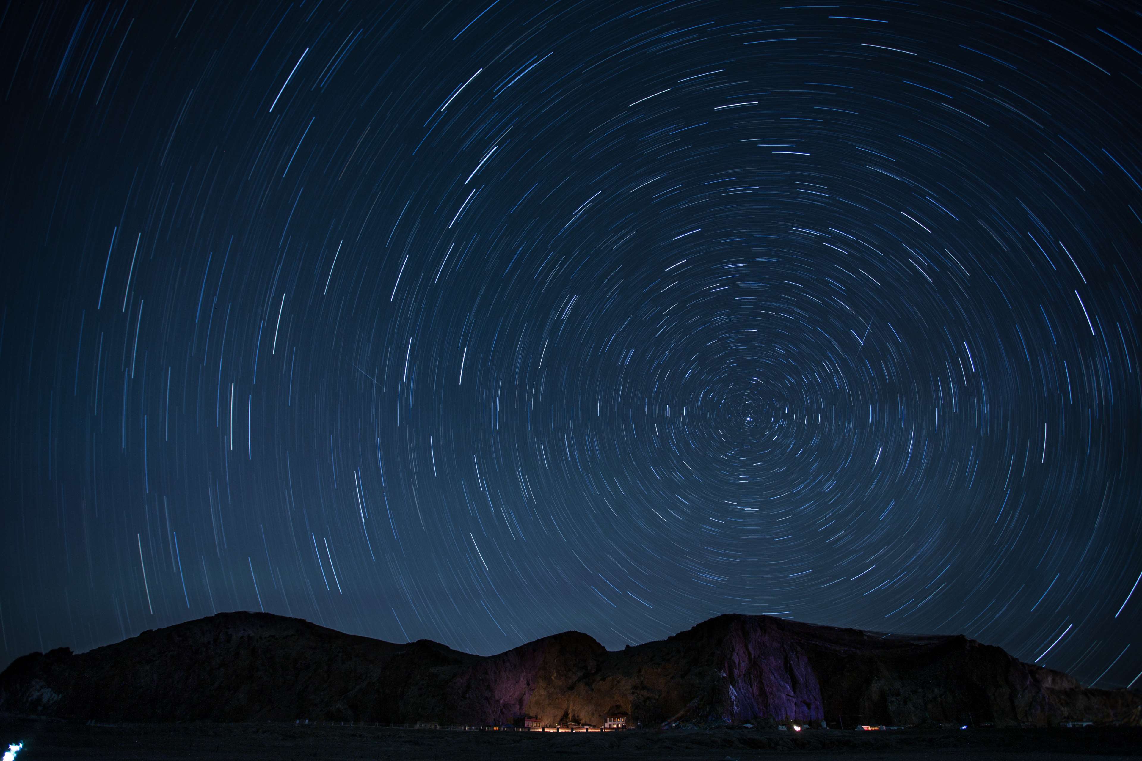 Star trails over mountains at night 4K HD Wallpaper