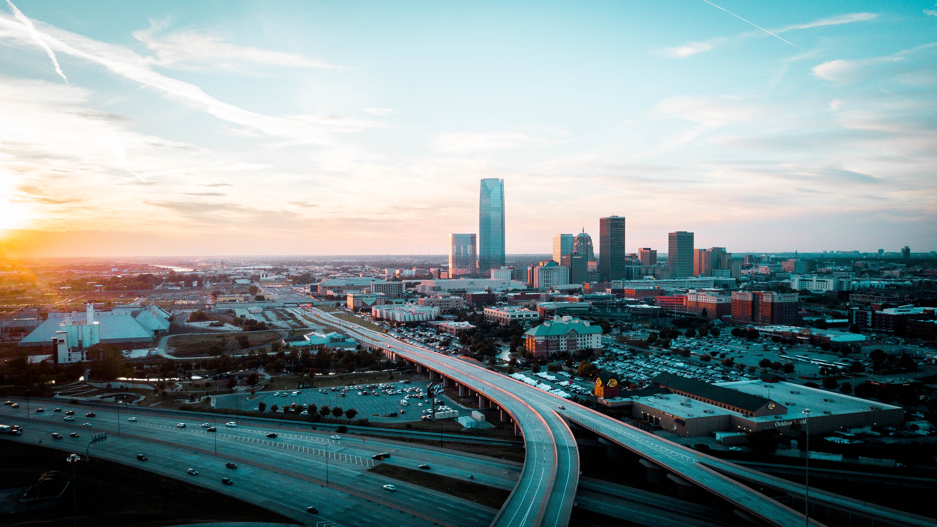 Oklahoma City skyline with highways at sunset HD Wallpaper