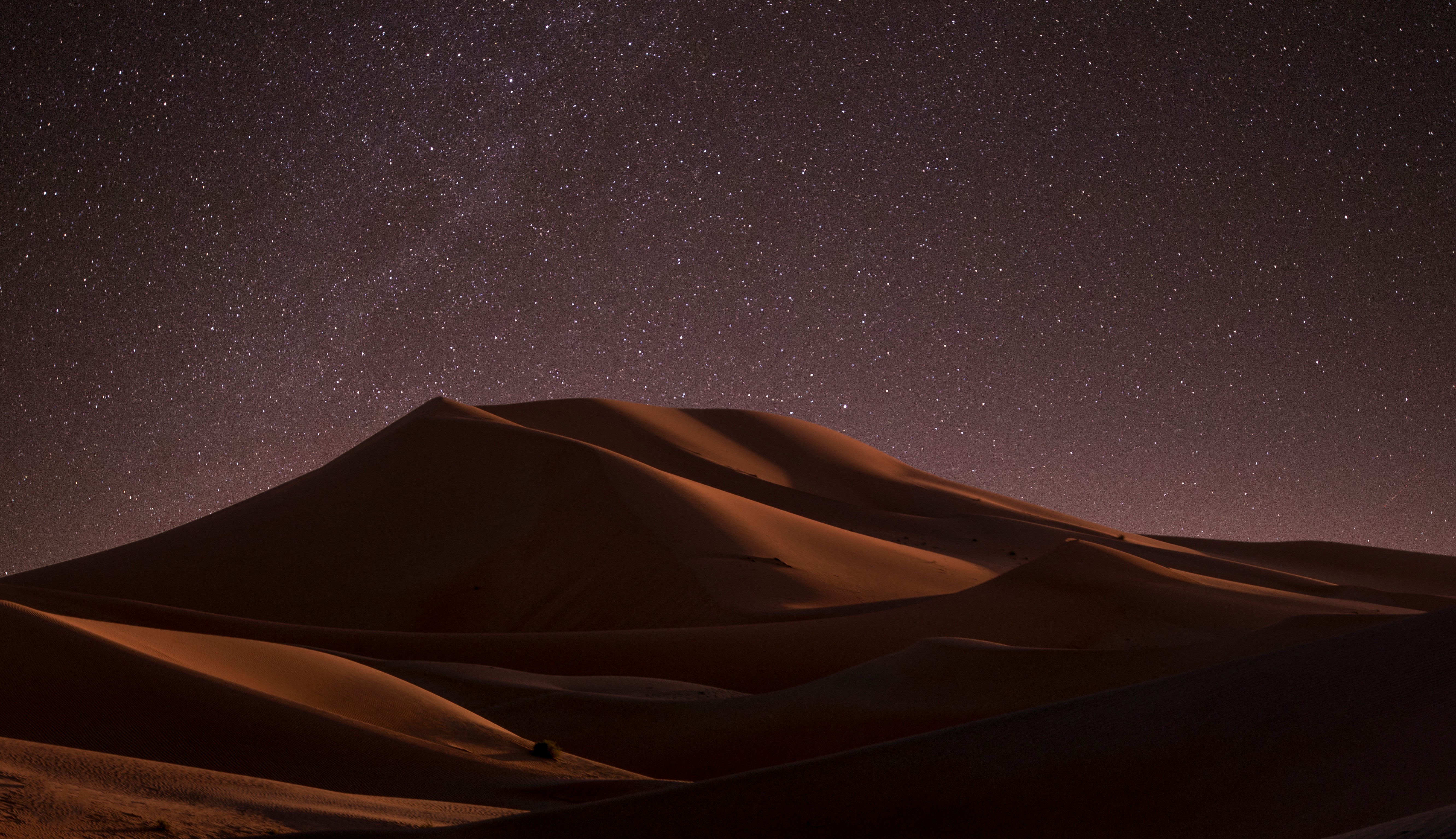 Desert dunes under a starry night sky HD Wallpaper