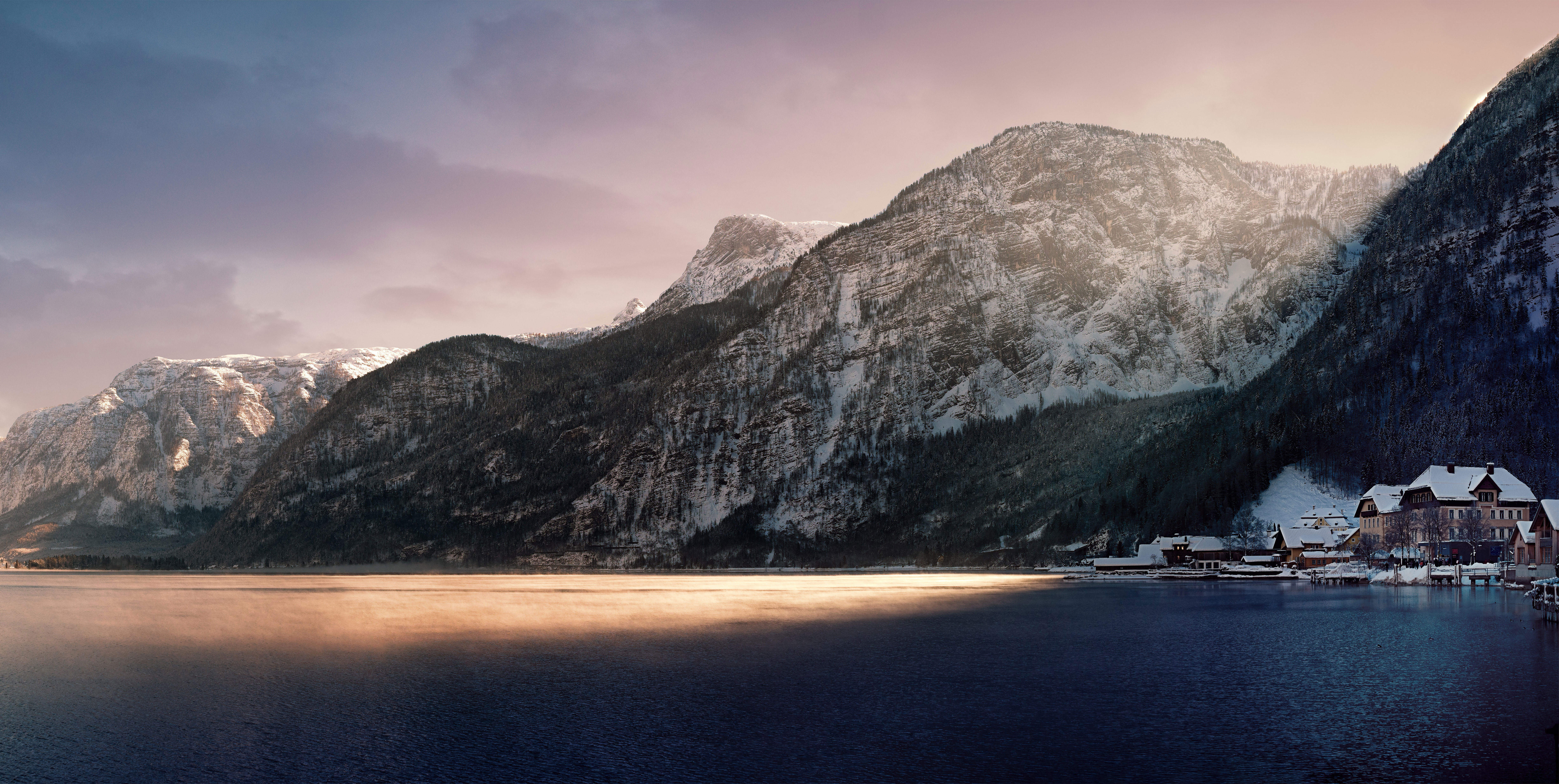 Snowy mountains over a lake with a village HD Wallpaper