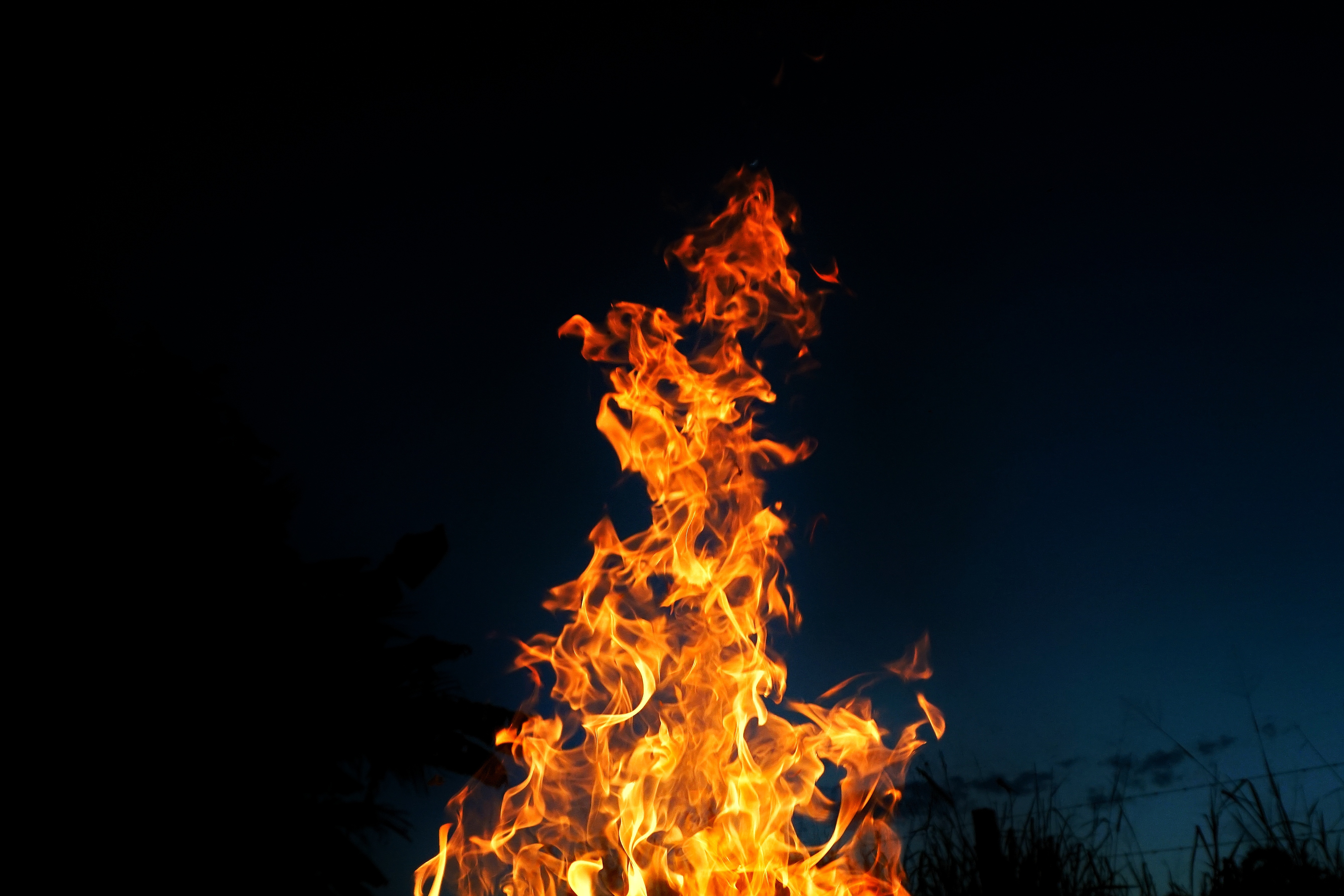 4K Vivid Flames Against Dark Night Sky HD Wallpaper