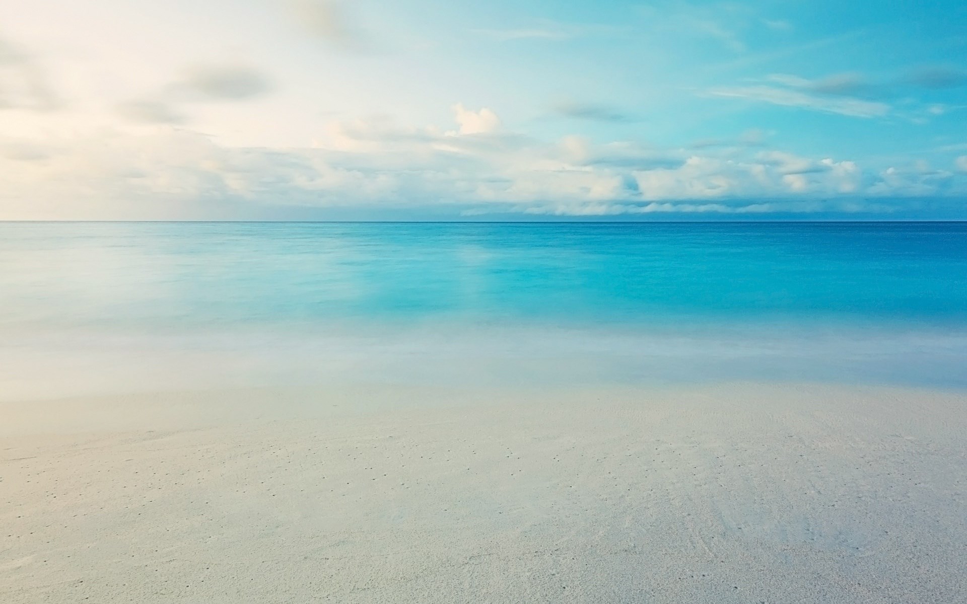 Ocean and beach with clouds HD Wallpaper