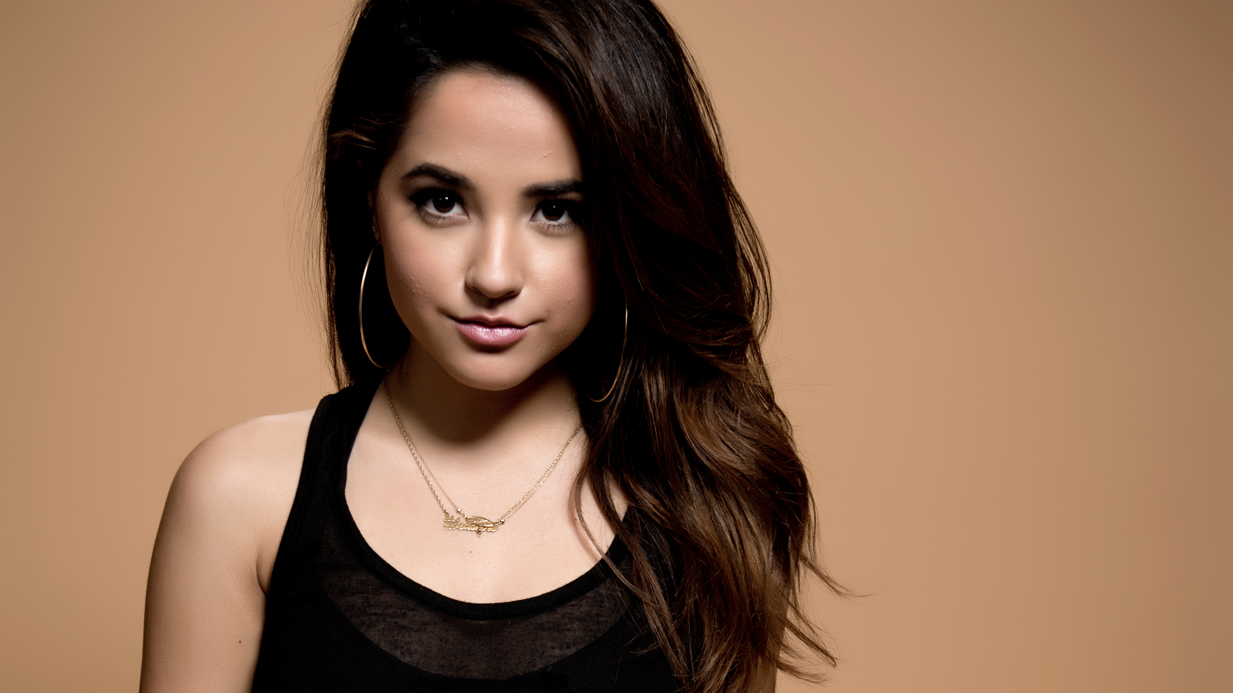Woman with long brown hair and hoop earrings HD Wallpaper