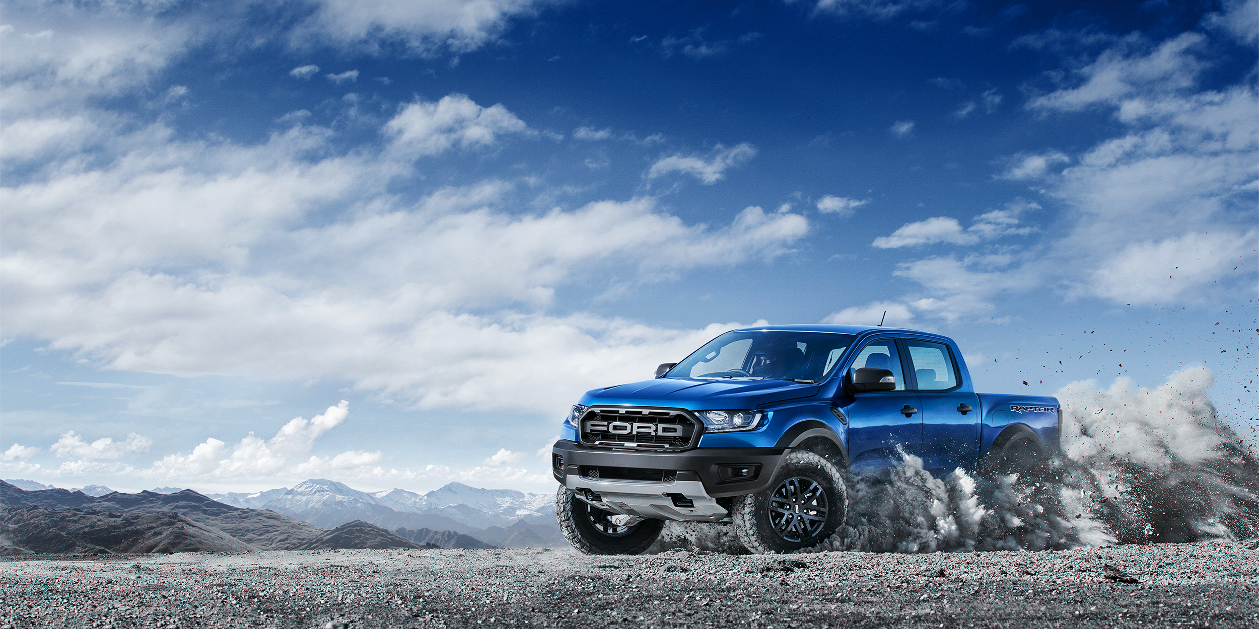 Blue Ford Ranger Raptor driving off-road HD Wallpaper
