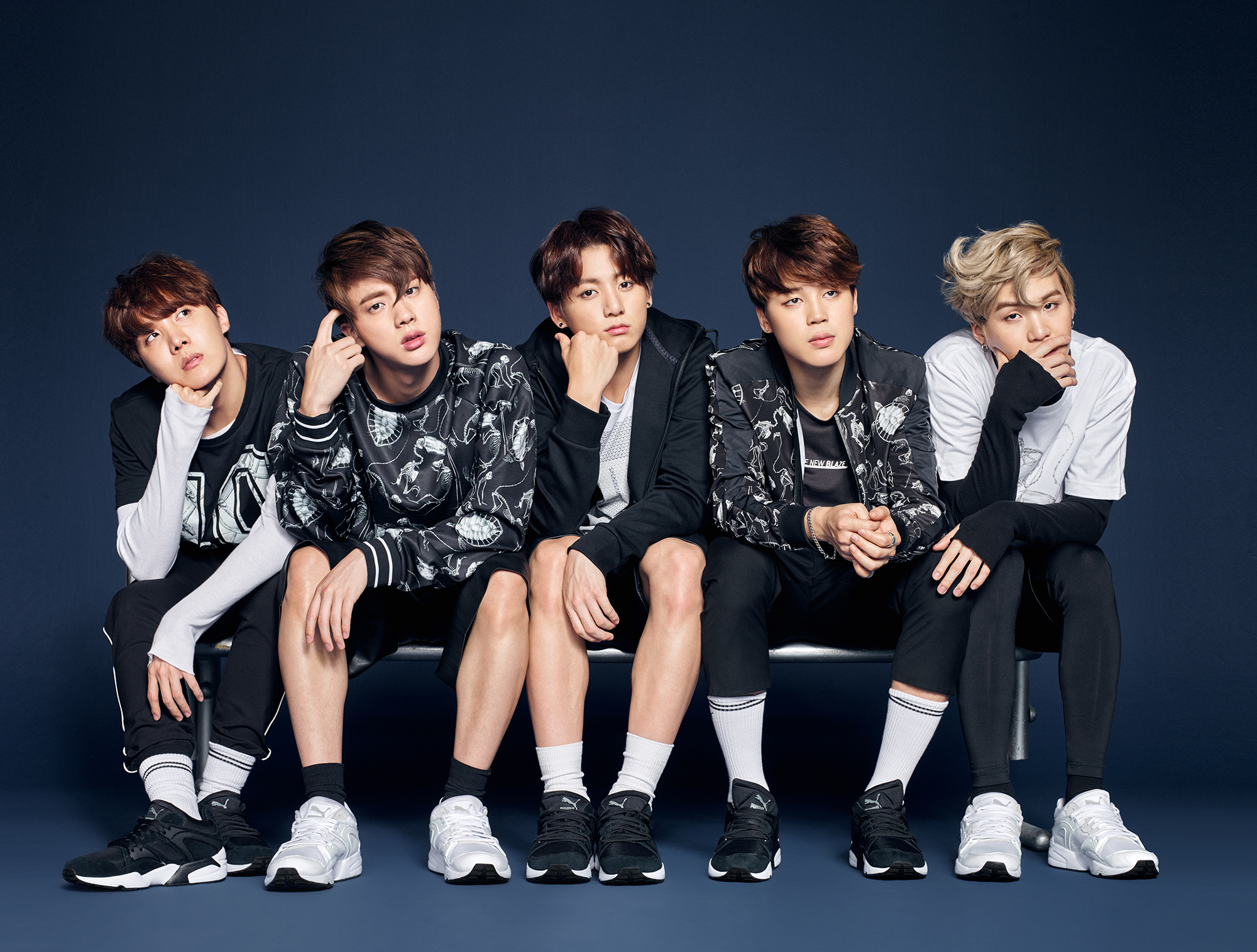 BTS members sitting on a bench HD Wallpaper