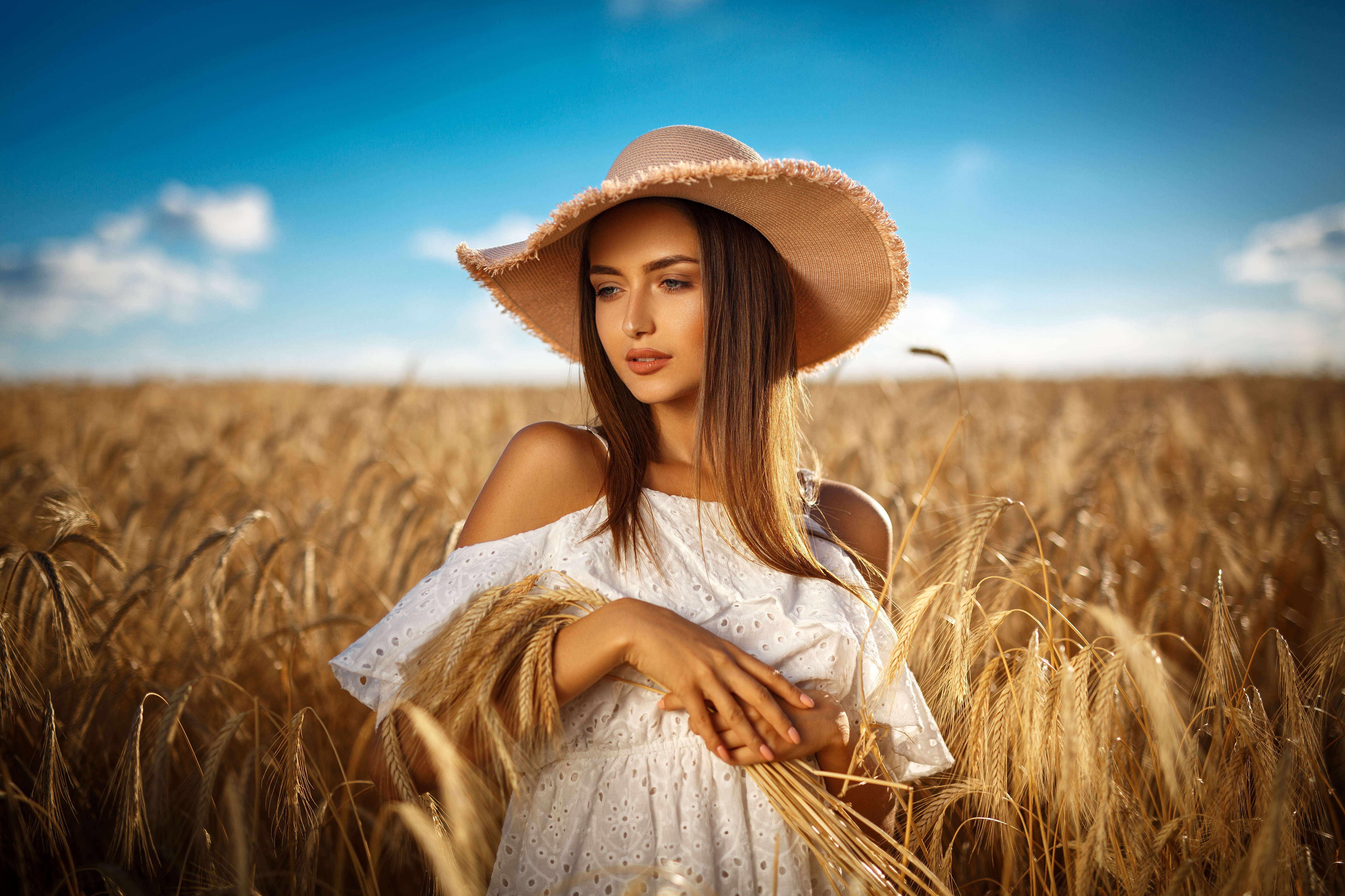 Woman in a straw hat in a wheat field HD Wallpaper