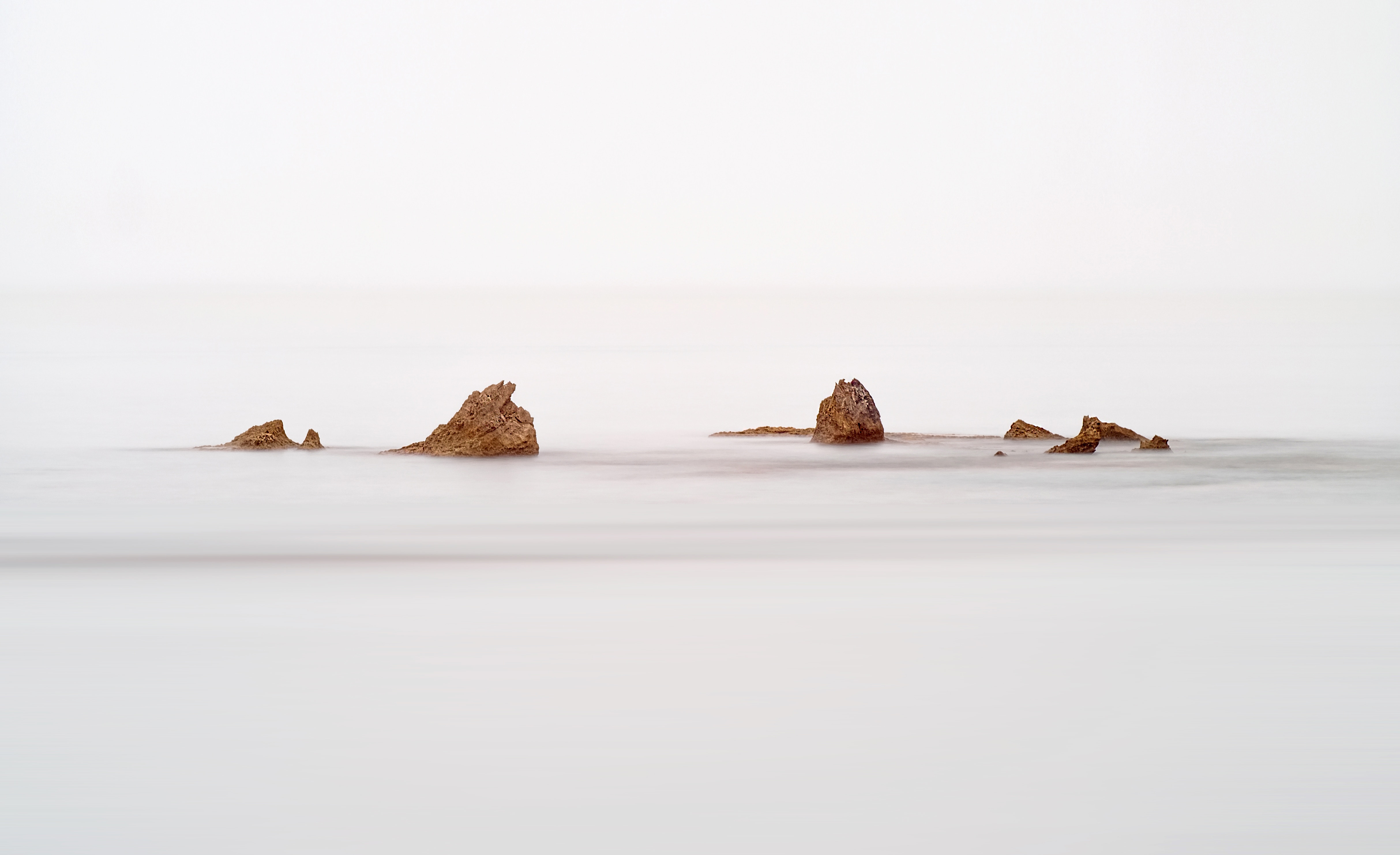Long exposure of rocks in the ocean near Tel Aviv, Israel HD Wallpaper
