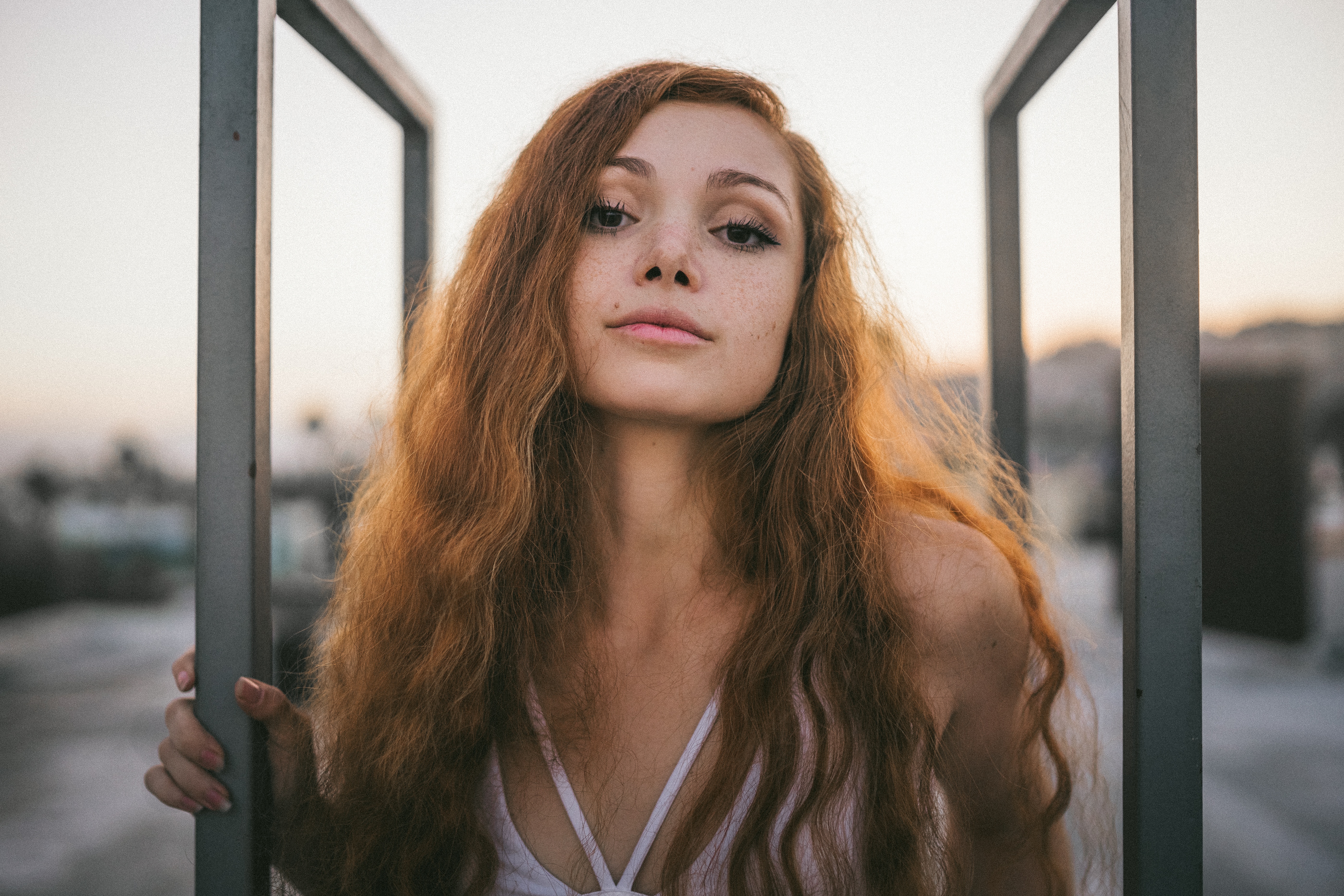 Ginger Woman Posing on Rooftop at Dusk HD Wallpaper